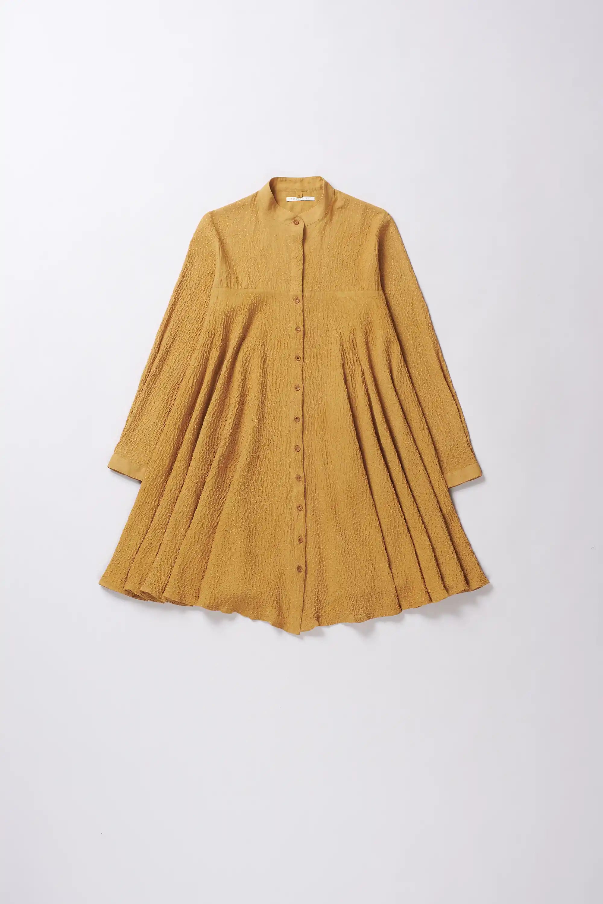 Mustard yellow dress on a white background