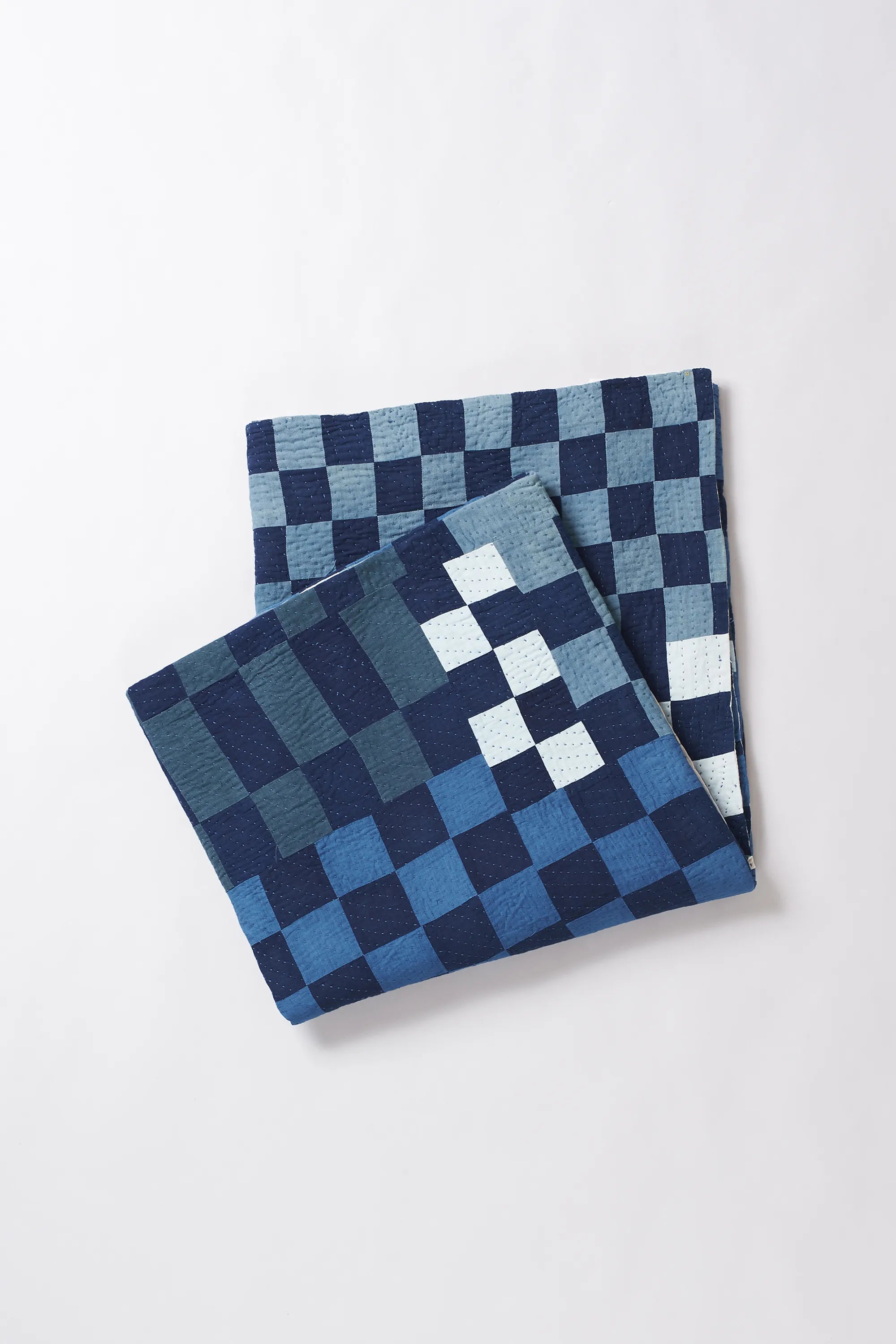 Folded fabric with white and indigo pattern 