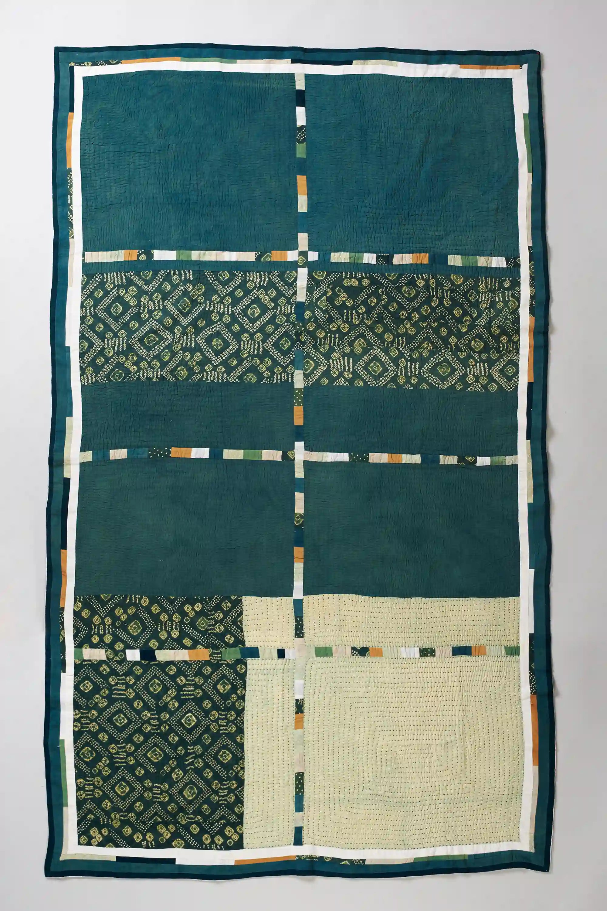 Patchwork turf green quilt with hand work
