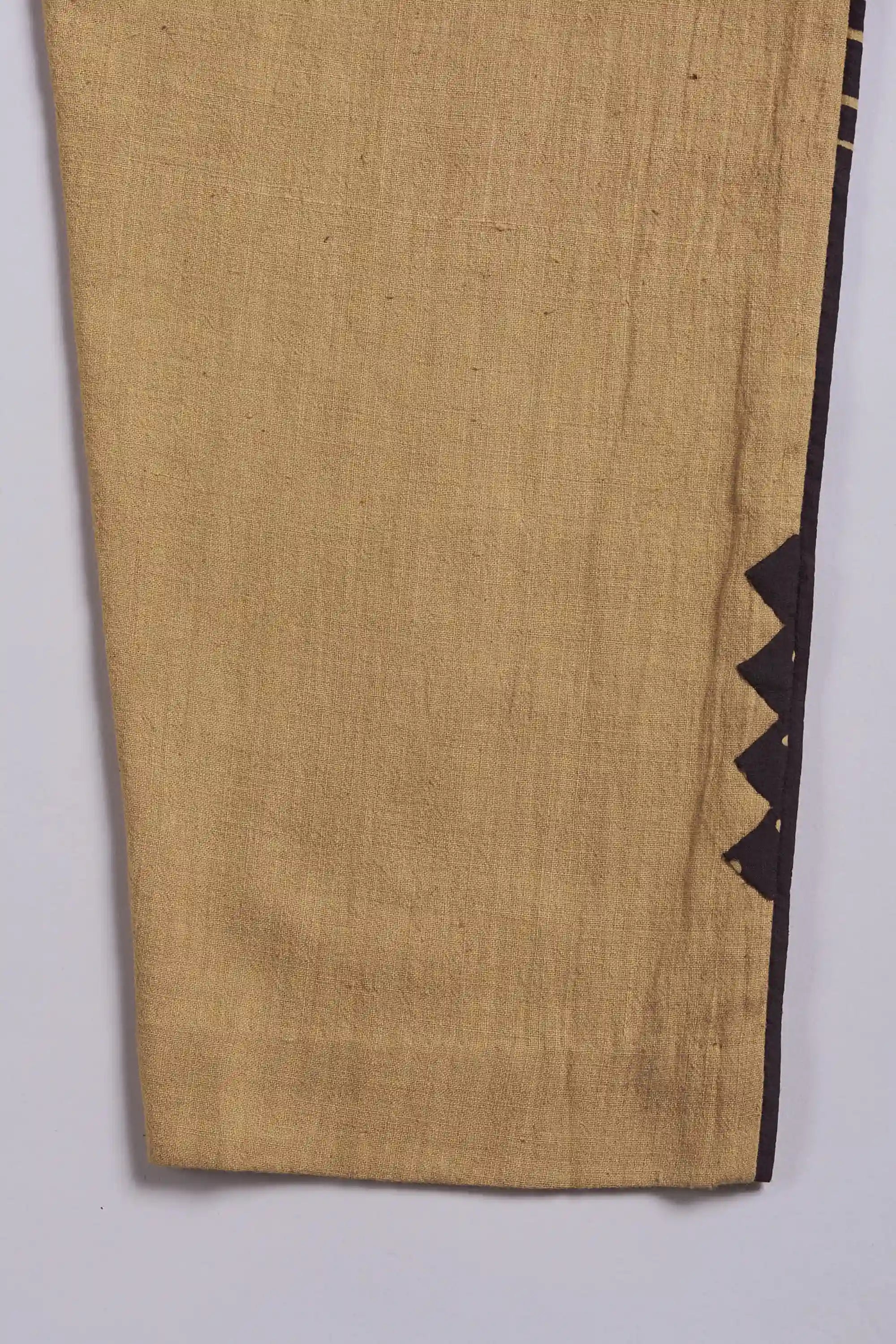 Close-up of fabric with black geometric pattern on a white background