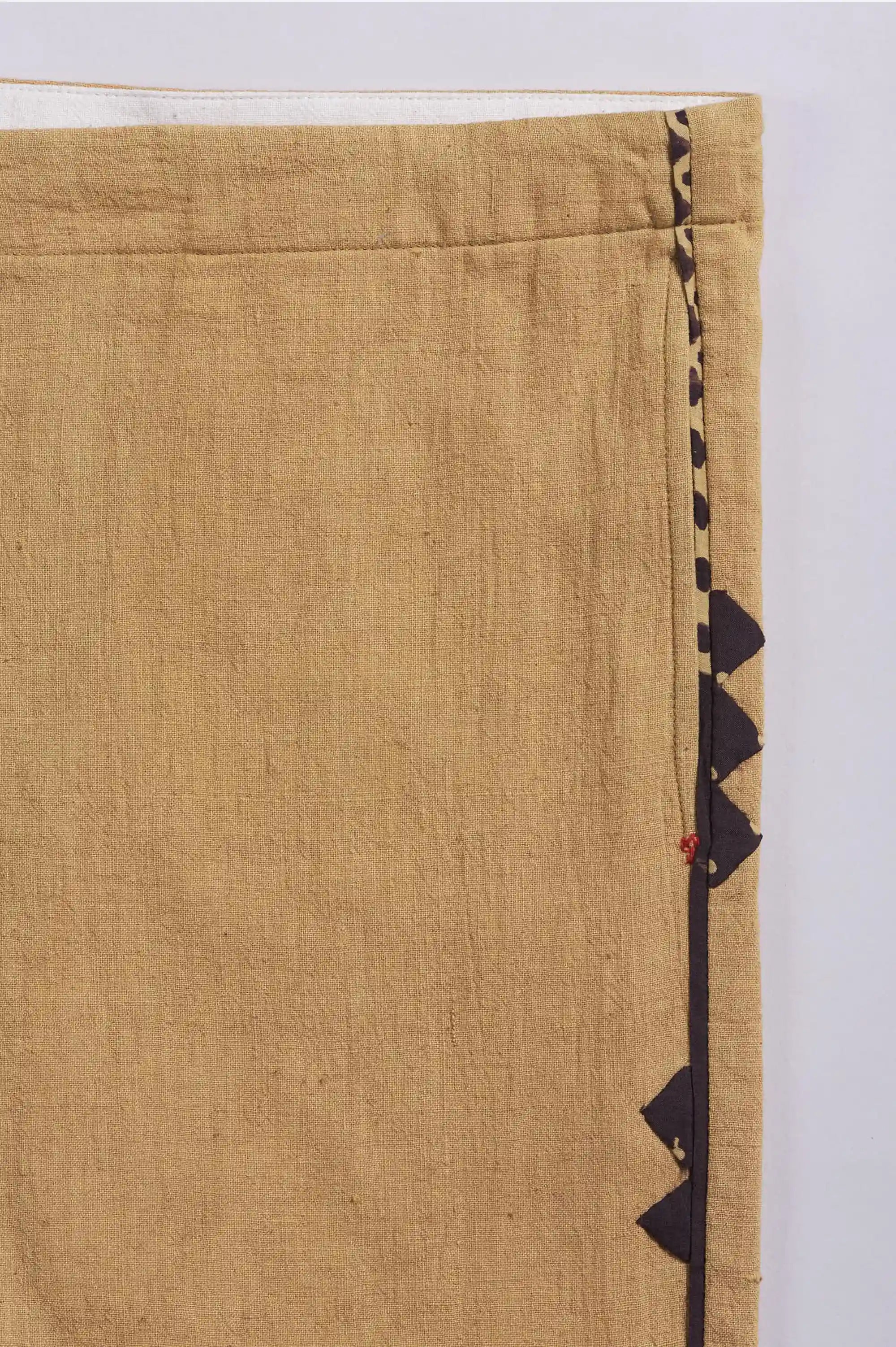 Close-up of a fabric with black geometric pattern on a white background