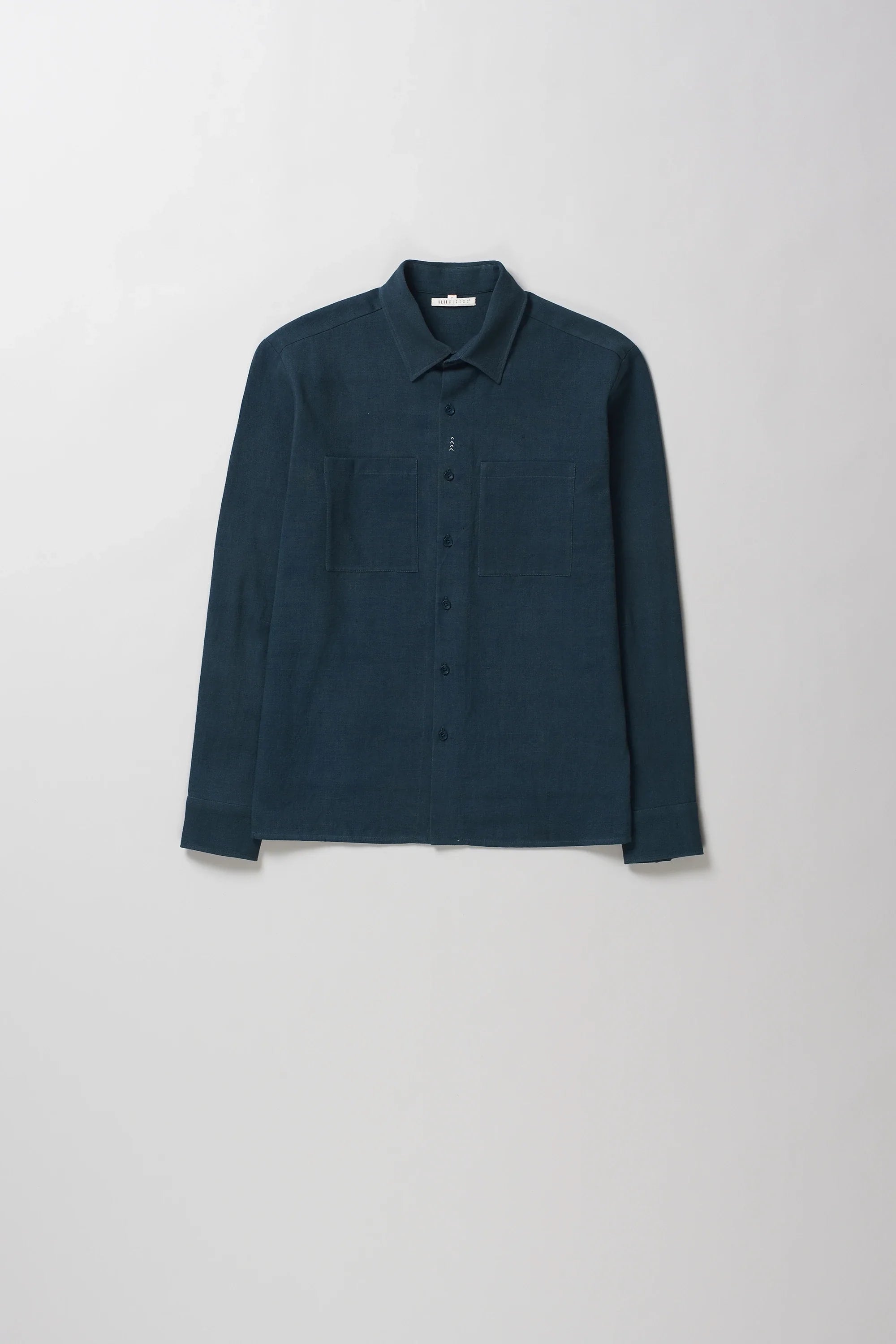 Front image of black indigo cotton shirt with pocket