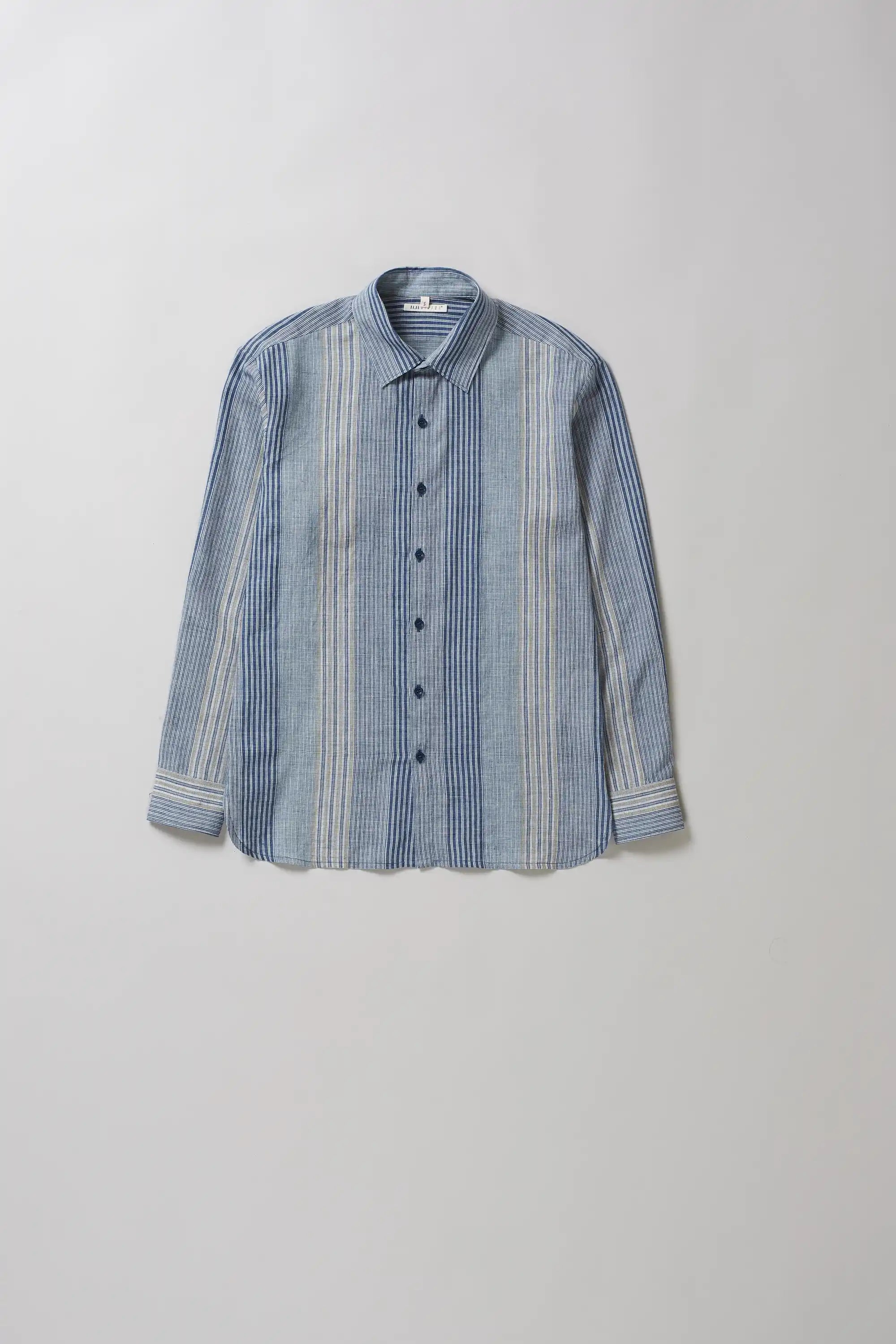 Blue striped shirt on a light grey background
