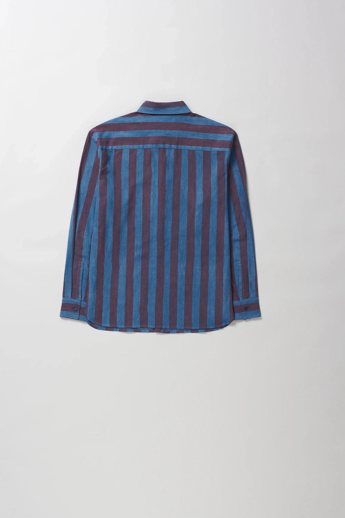 A long-sleeve button-up shirt with vertical stripes in blue and dark red, shown from the back against a light grey background.