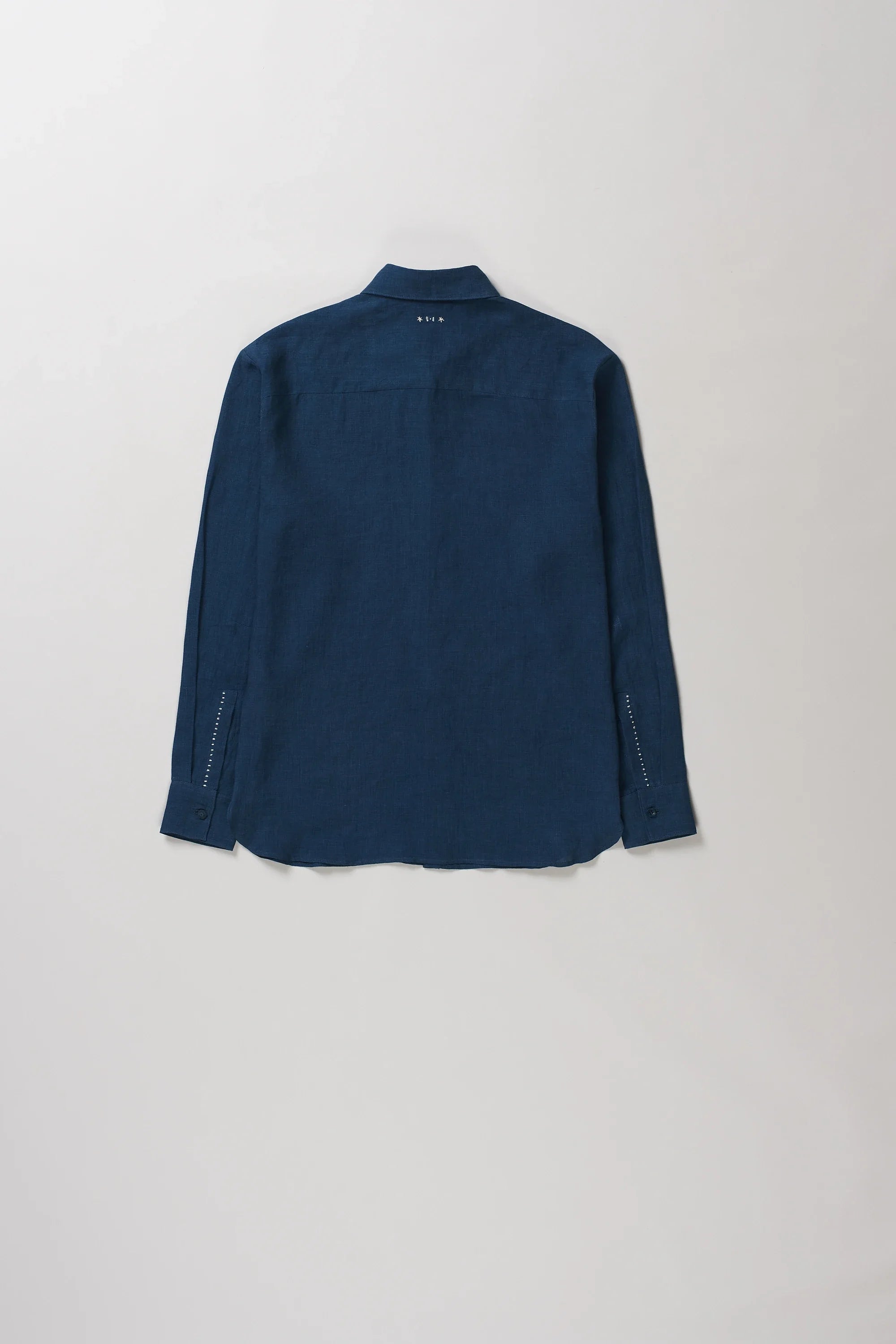 Back image of space blue linen shirt with hand details