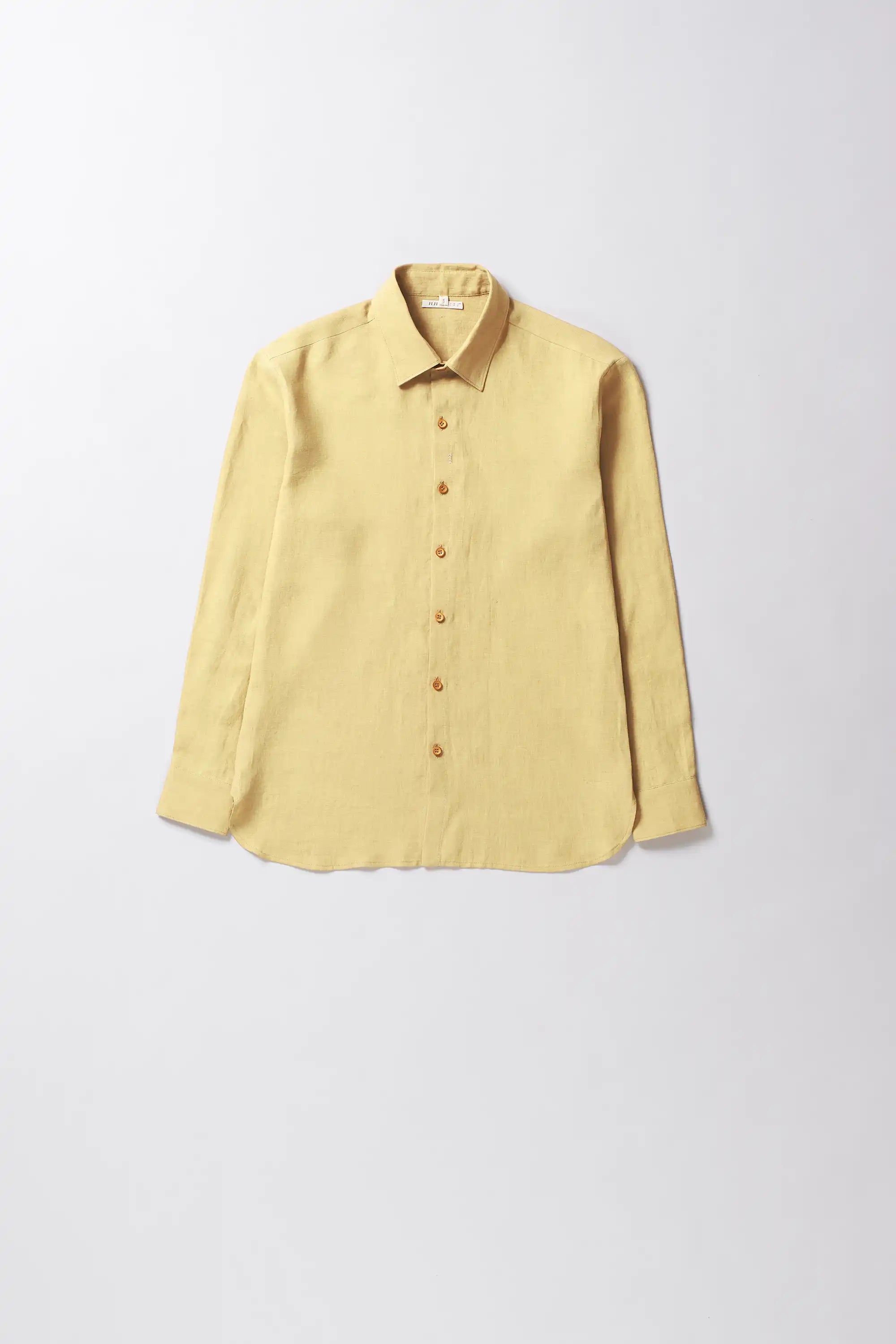 Yellow shirt collar on a light gray background