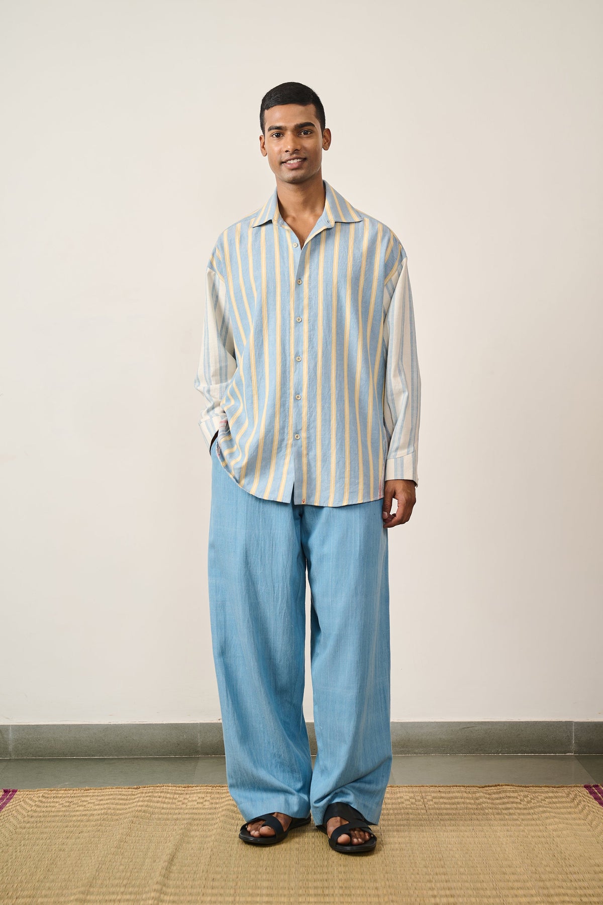 A man wearing multi colour shirt