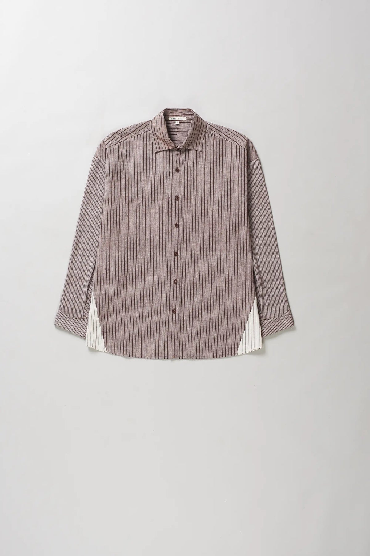 A long-sleeve button-up shirt with vertical stripes in brown and beige on a light grey background.