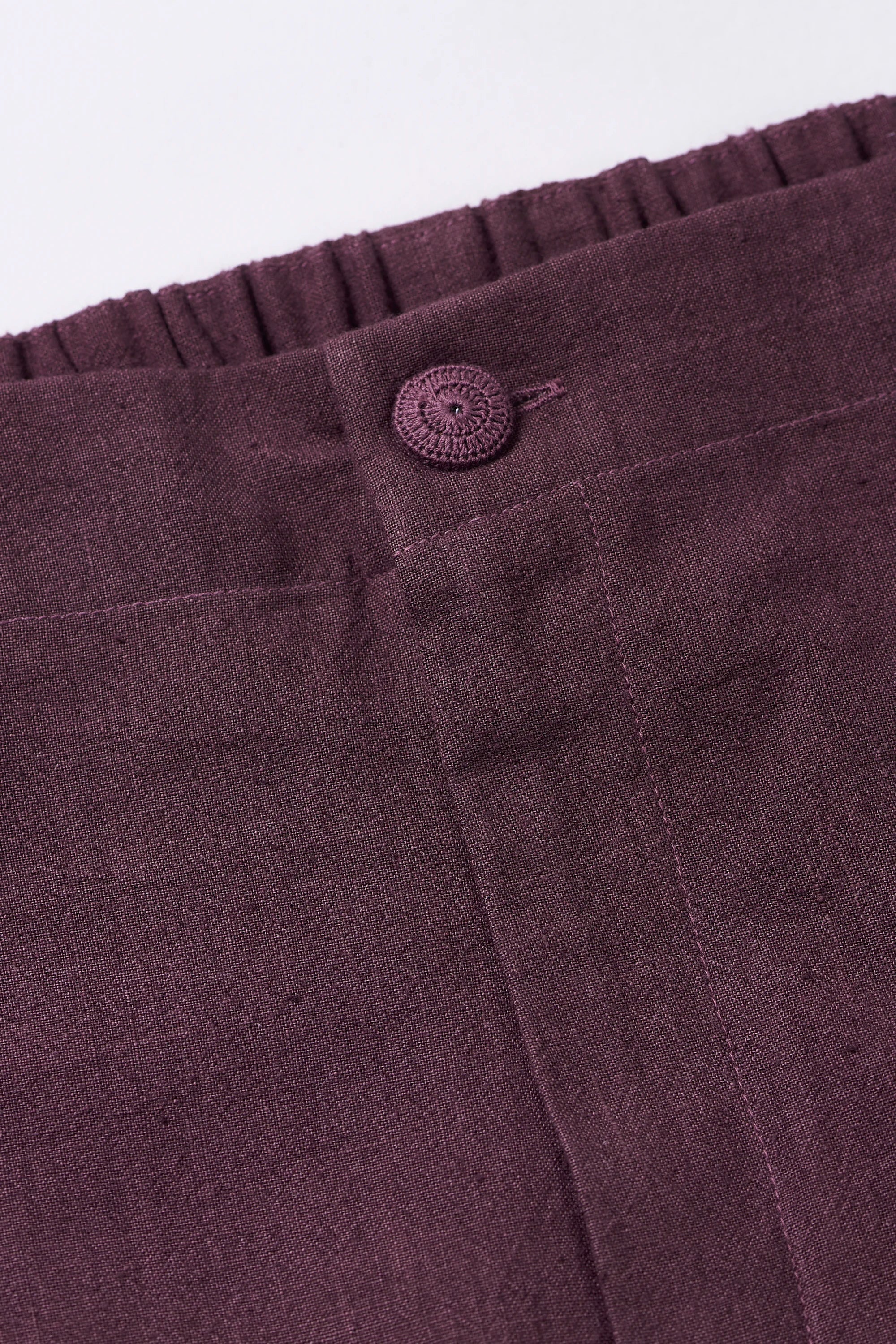 TAPERED FIT TROUSERS IN PURPLE RED
