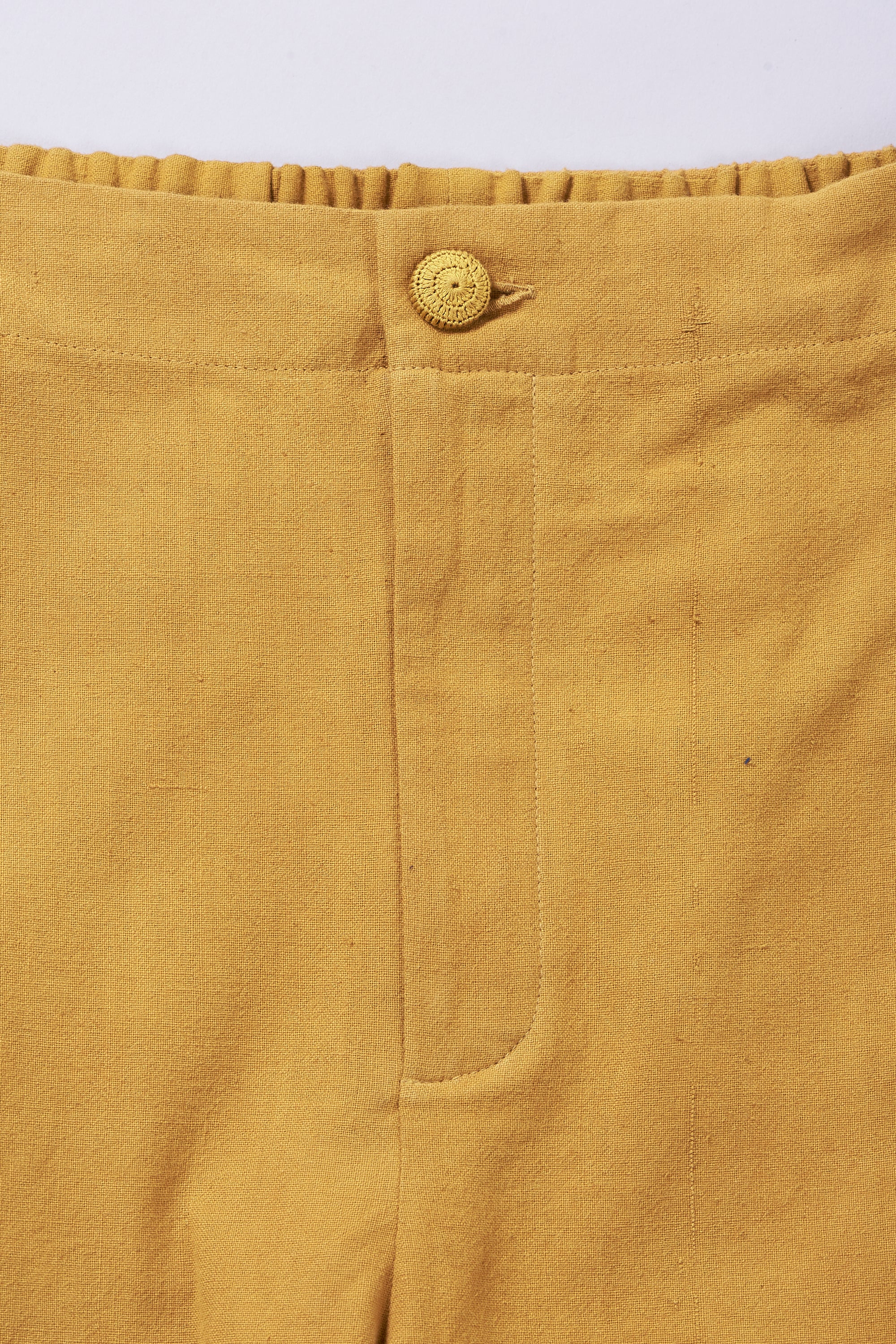 TAPERED FIT TROUSERS IN MUSTARD YELLOW