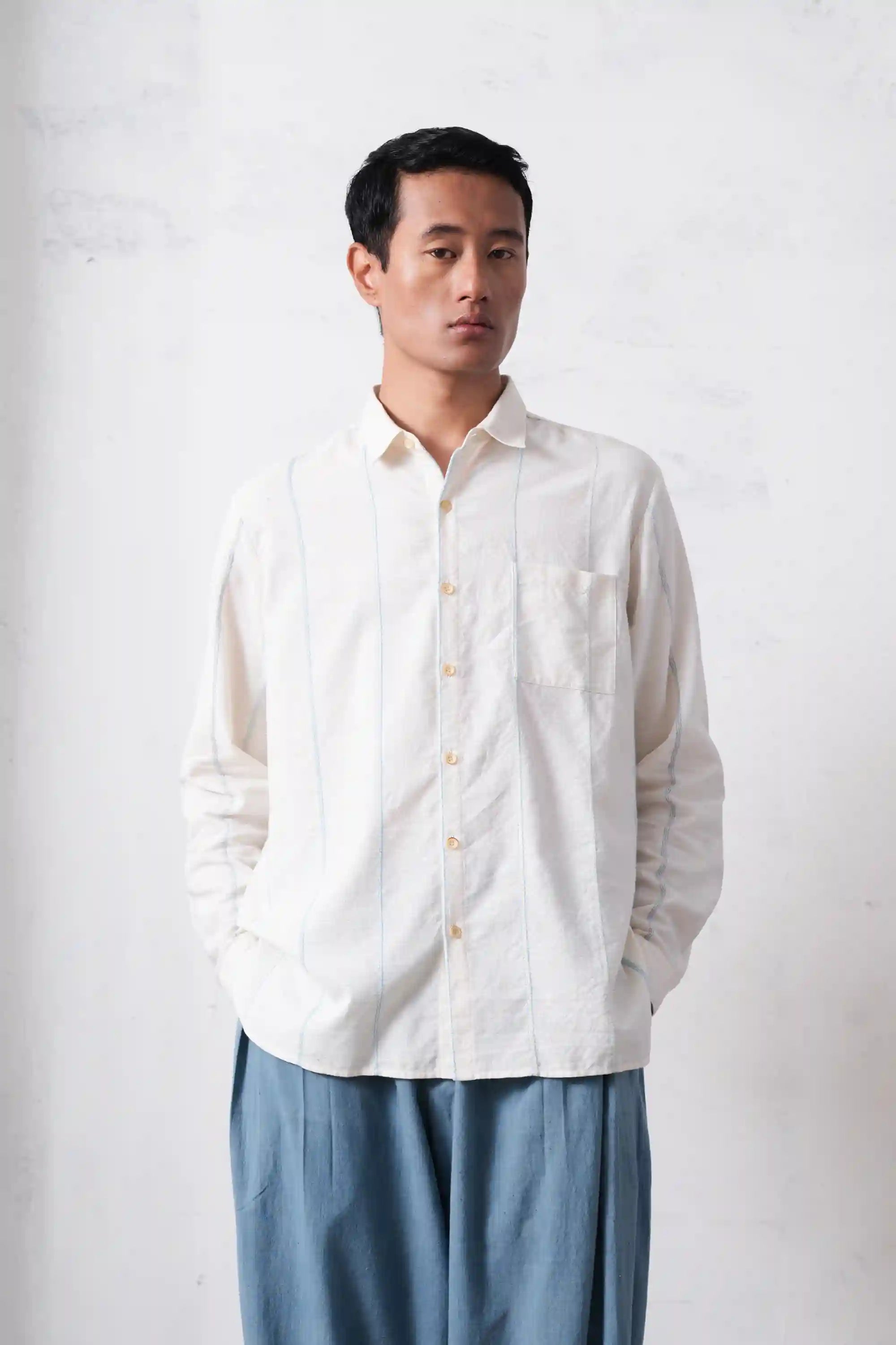 A man wearing ecru cotton shirt