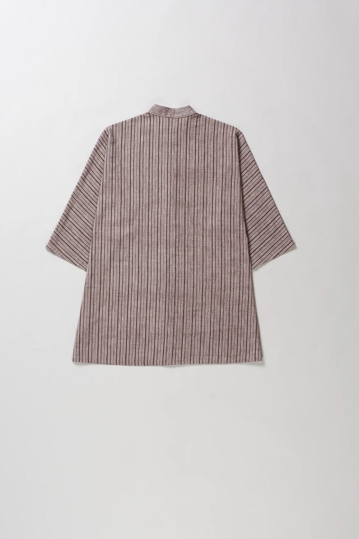 Back shot of short-sleeve button-up shirt with a vertical stripe pattern in brown and beige, shown from the back on a light grey background.