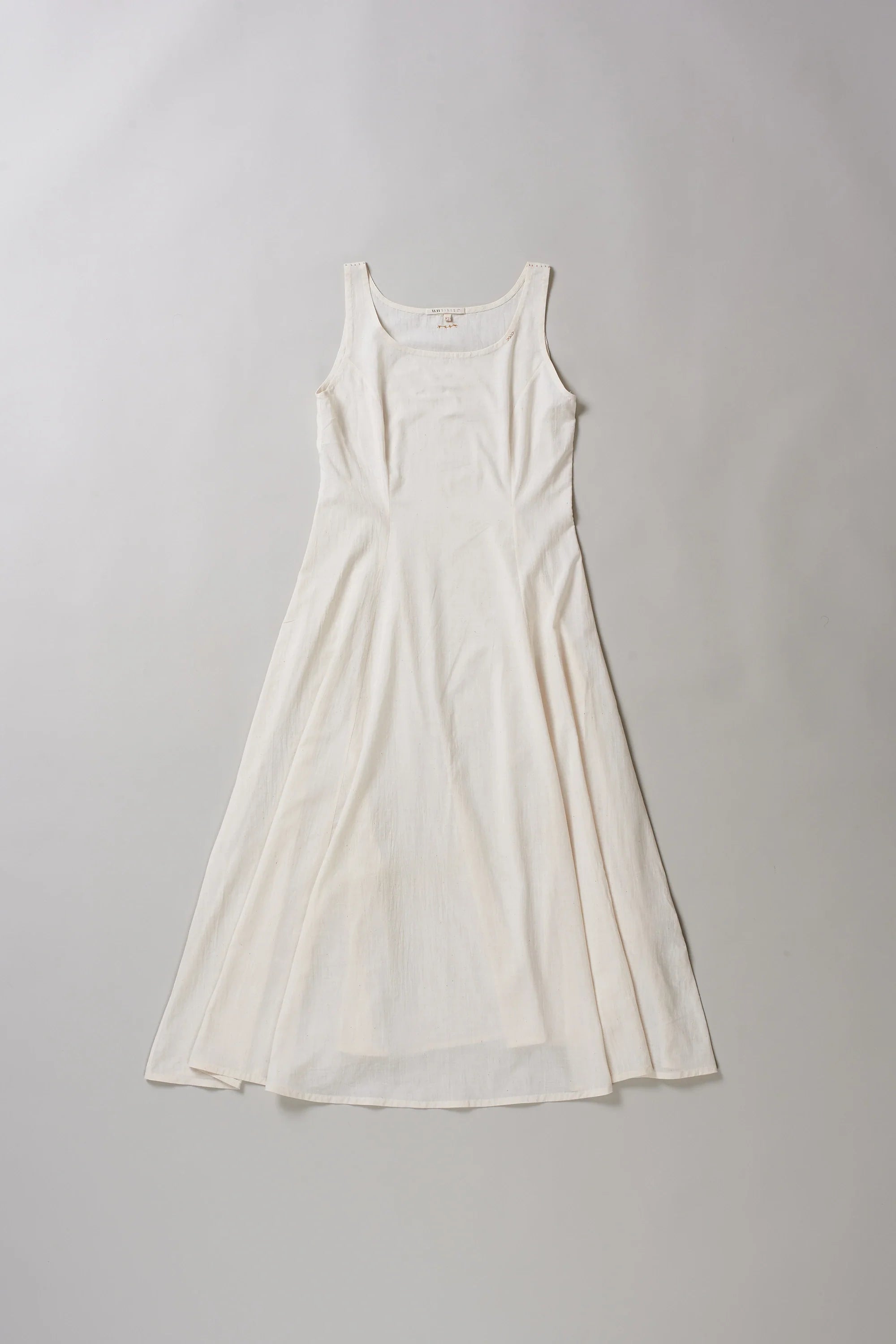 Front image of ecru dress on a grey background