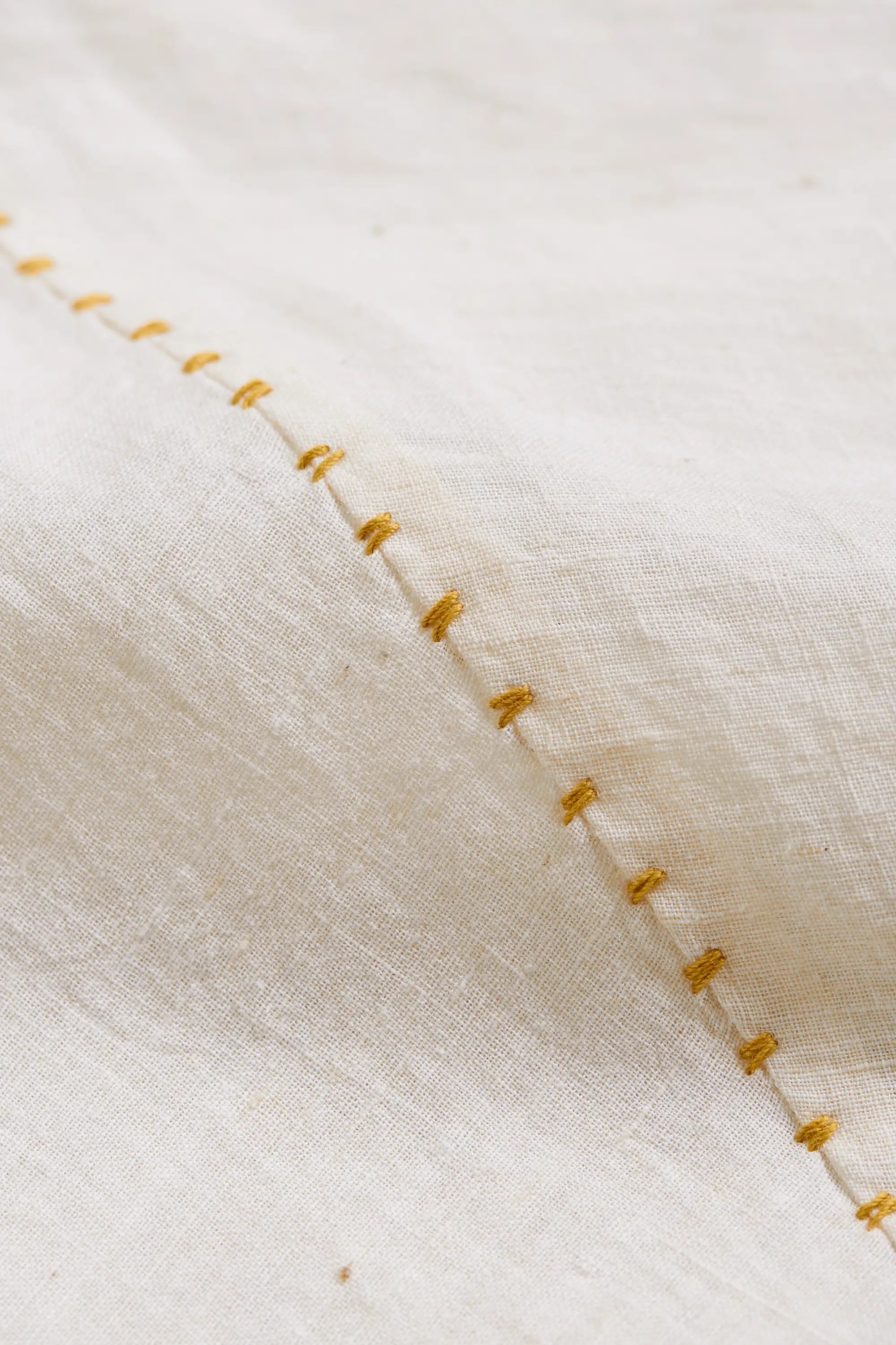 Fabric close-up with hand detailing