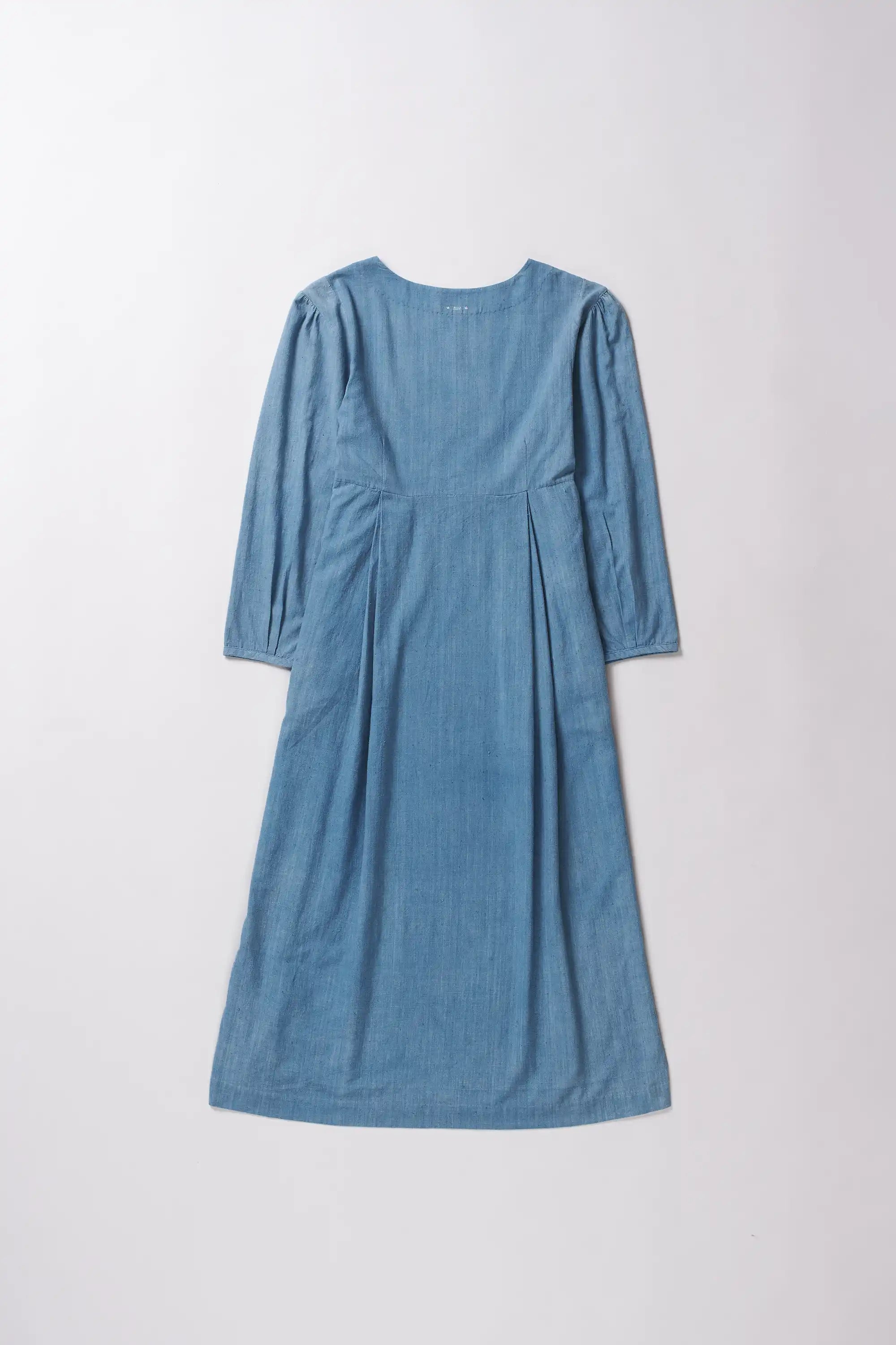 Blue dress with long sleeves on a white background