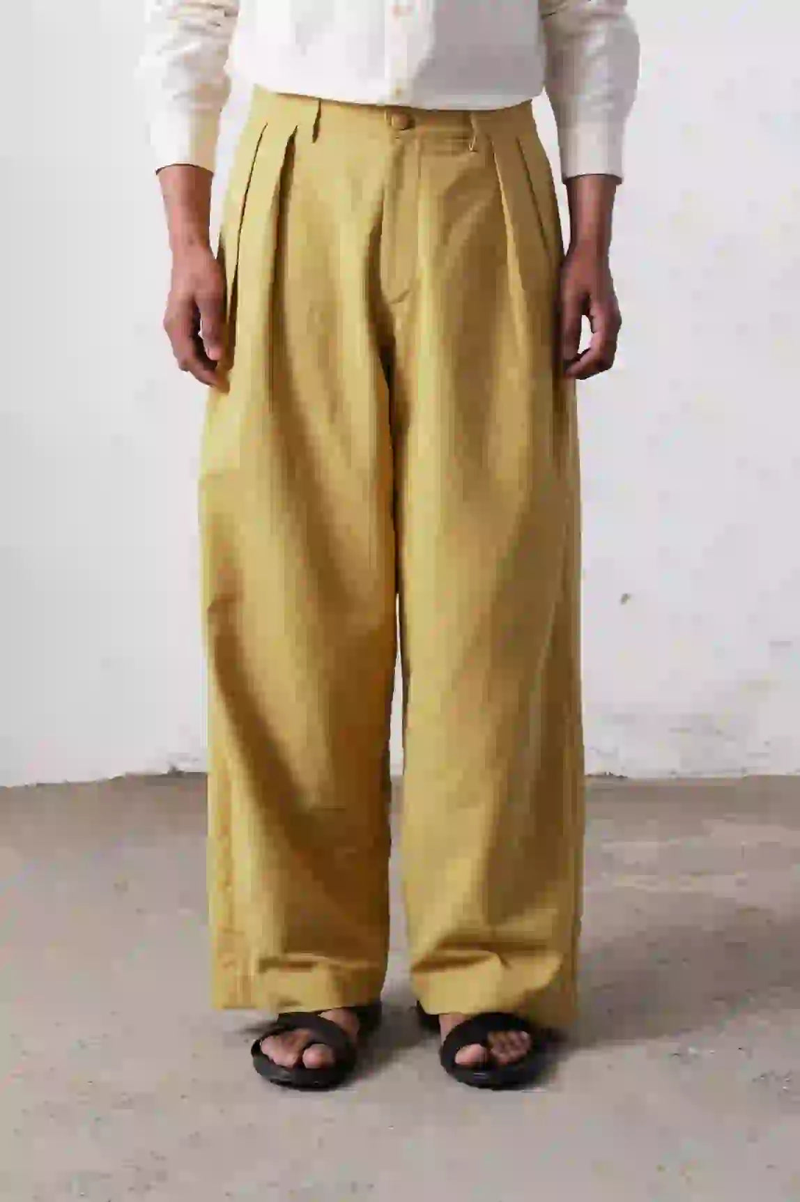 A man wearing ochre yellow pant
