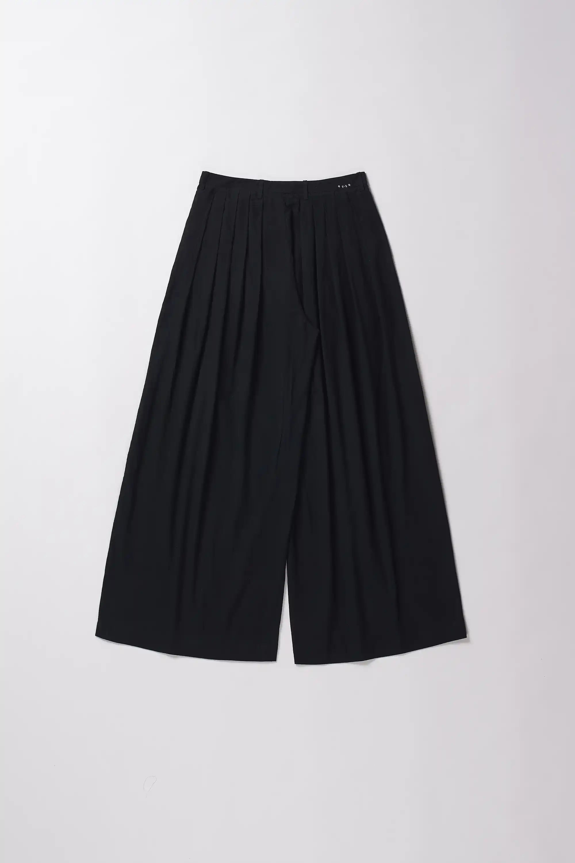 Back image of black wide-leg pants on a grey background