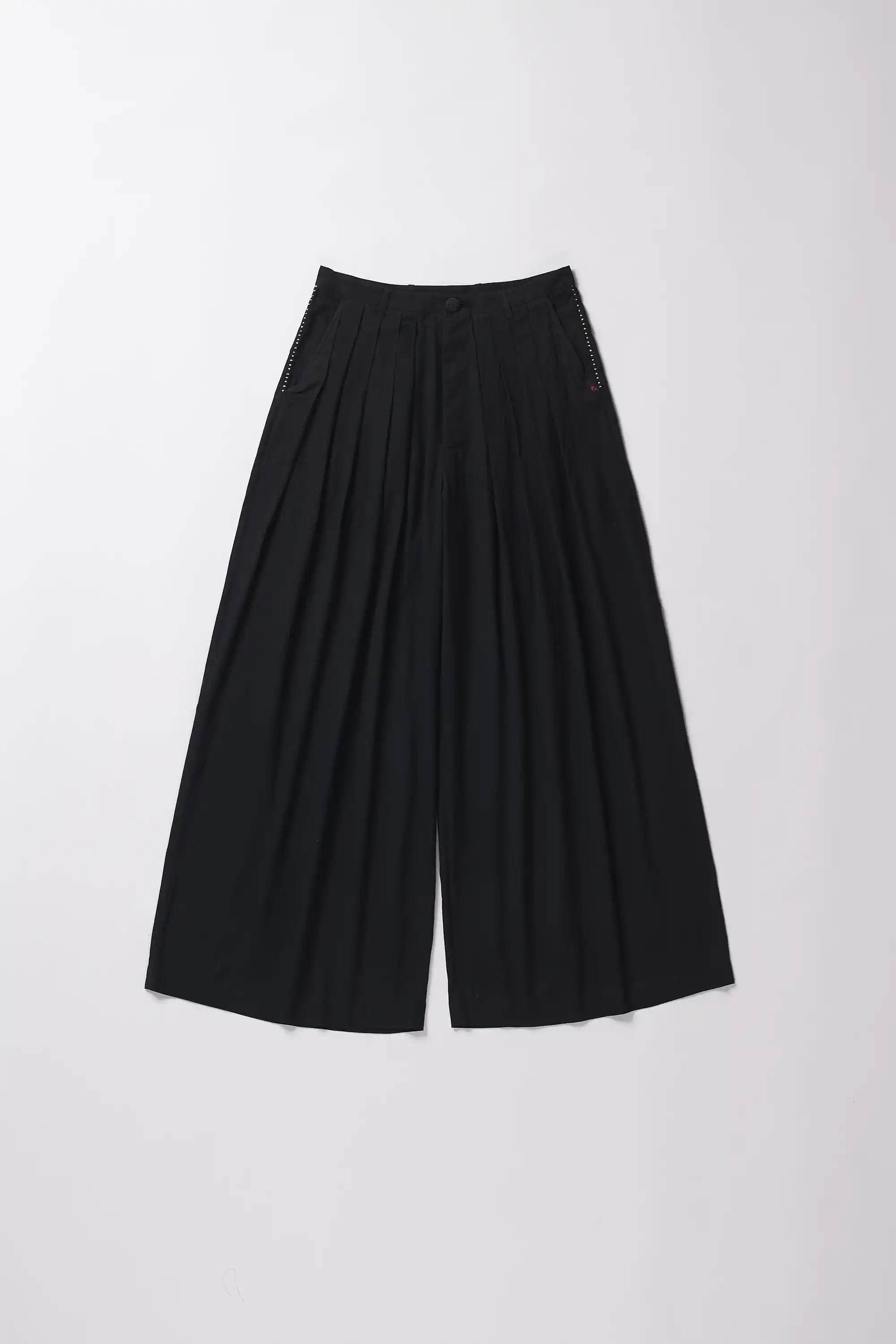 Black wide-leg pants on a grey background