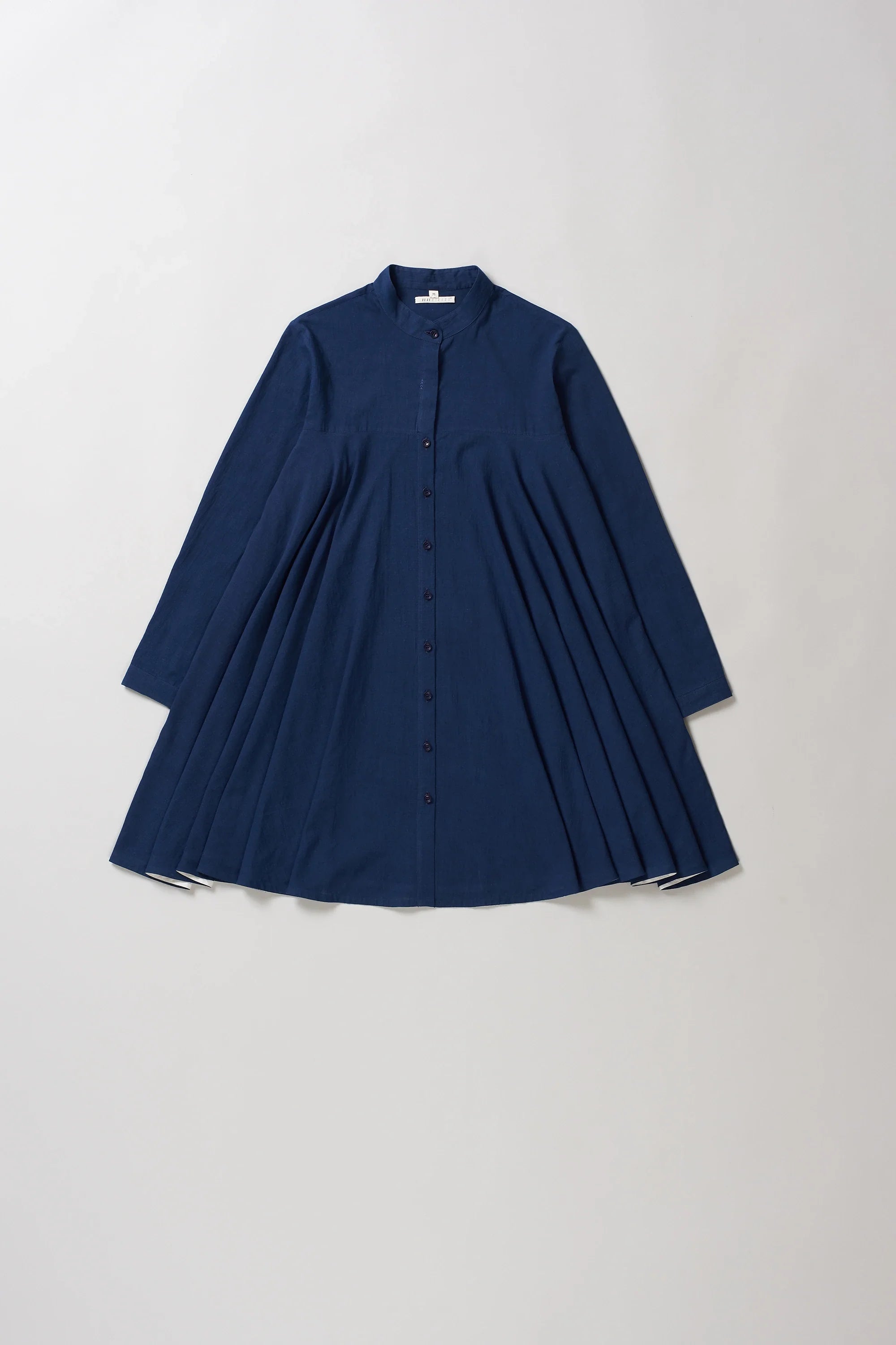 Front image of indigo dress on a light grey background