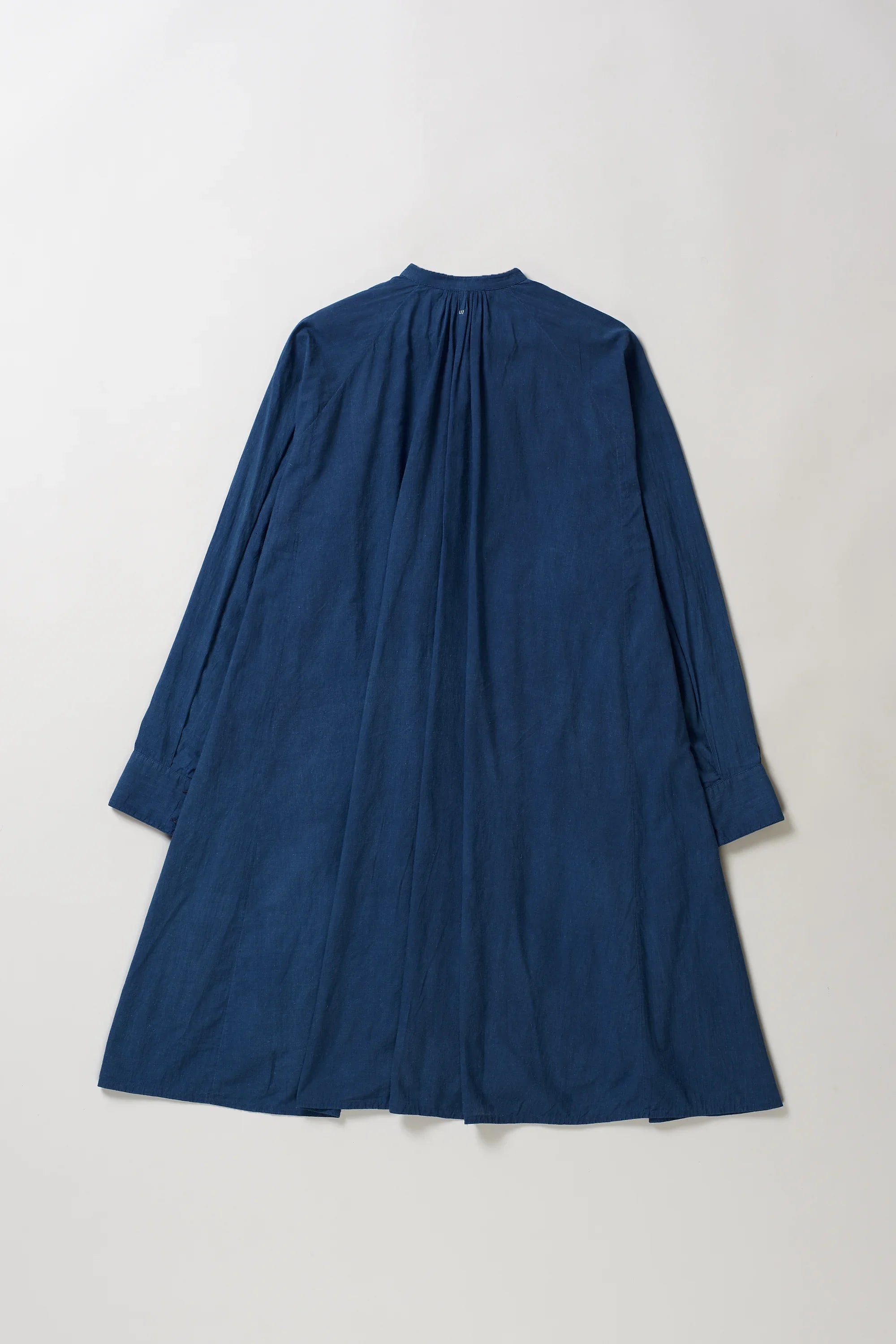 Blue dress on a light grey background