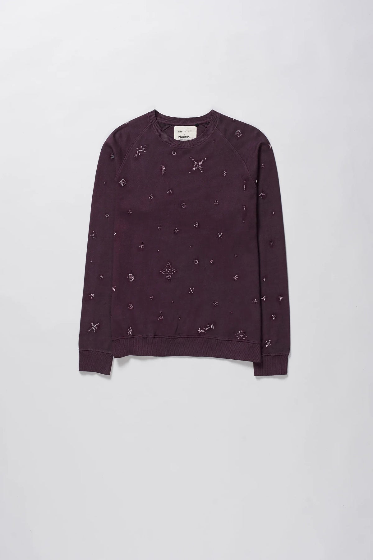A man wearing purple red sweatshirt