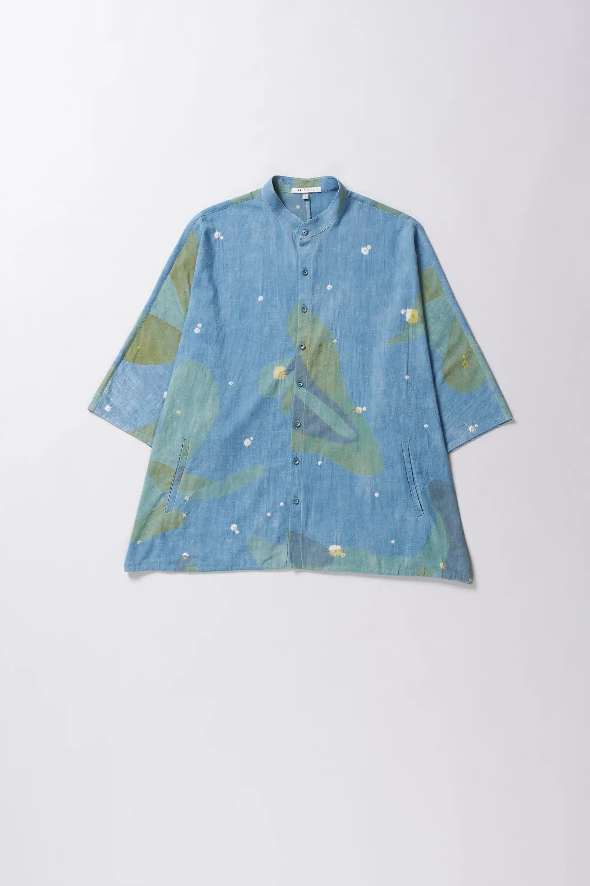 Blue shirt with hand paint on a white background