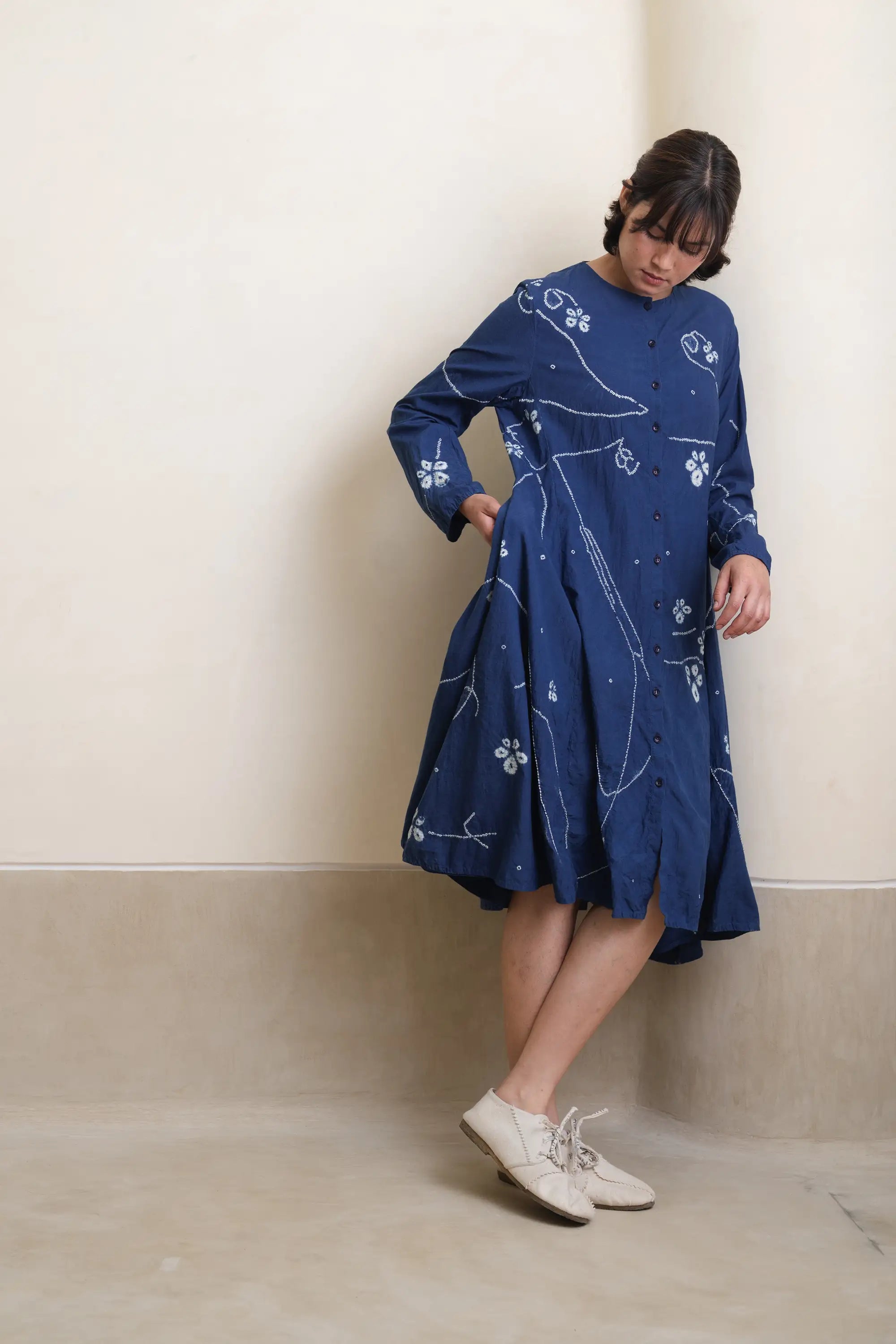 A woman wearing medium indigo dress