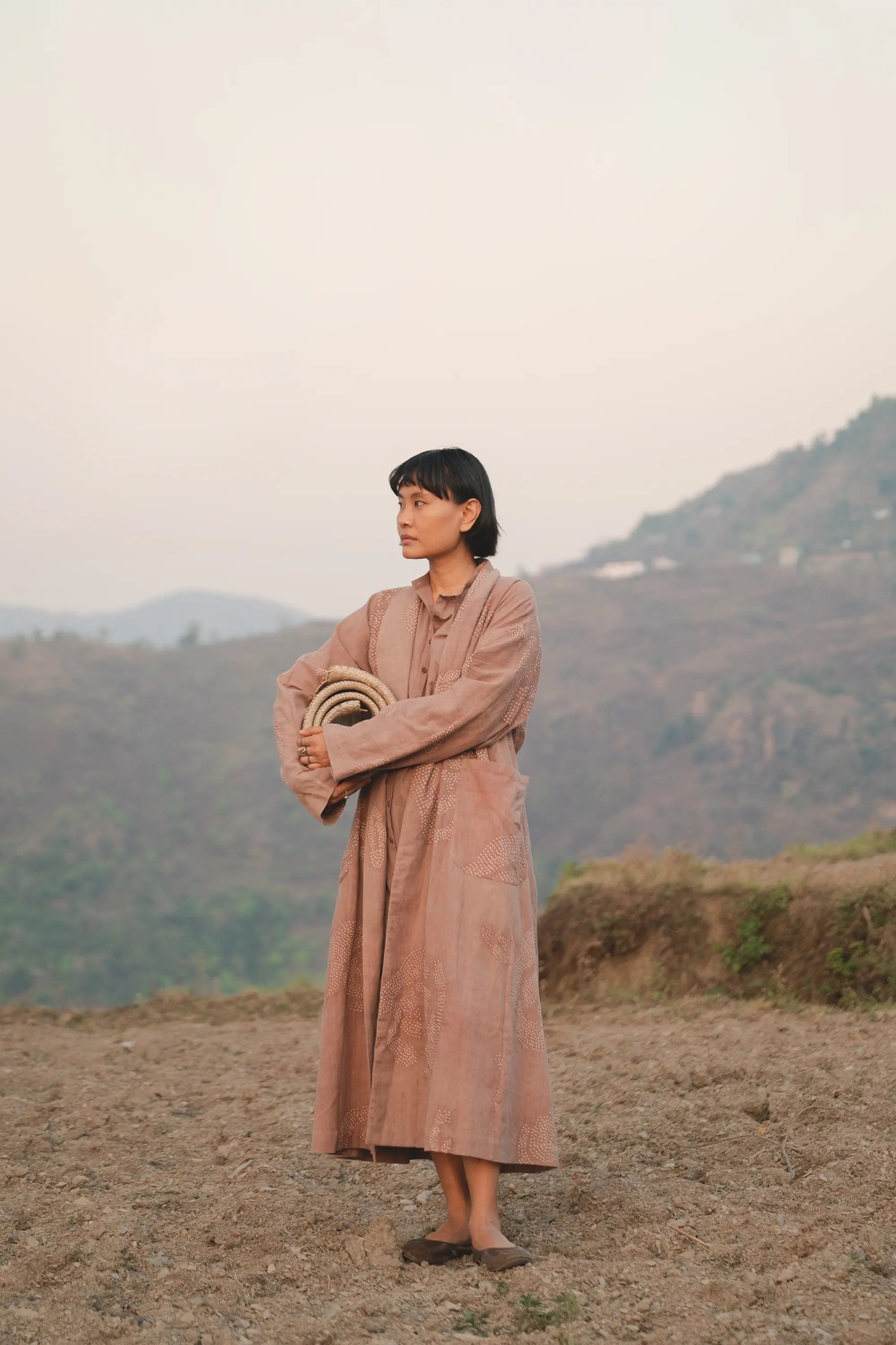A women wearing old rose cotton shrug