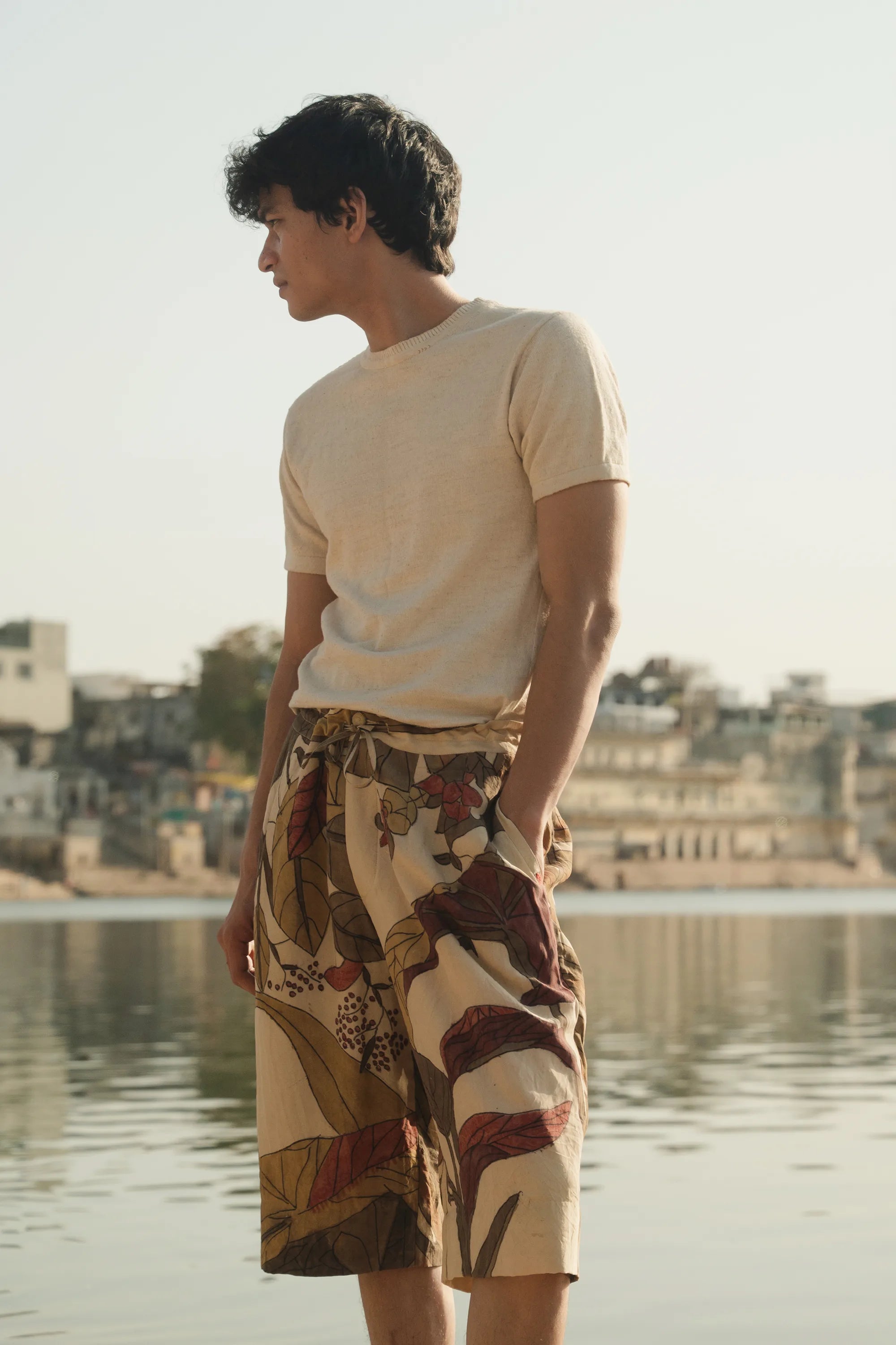 A man wearing ecru t-shirt