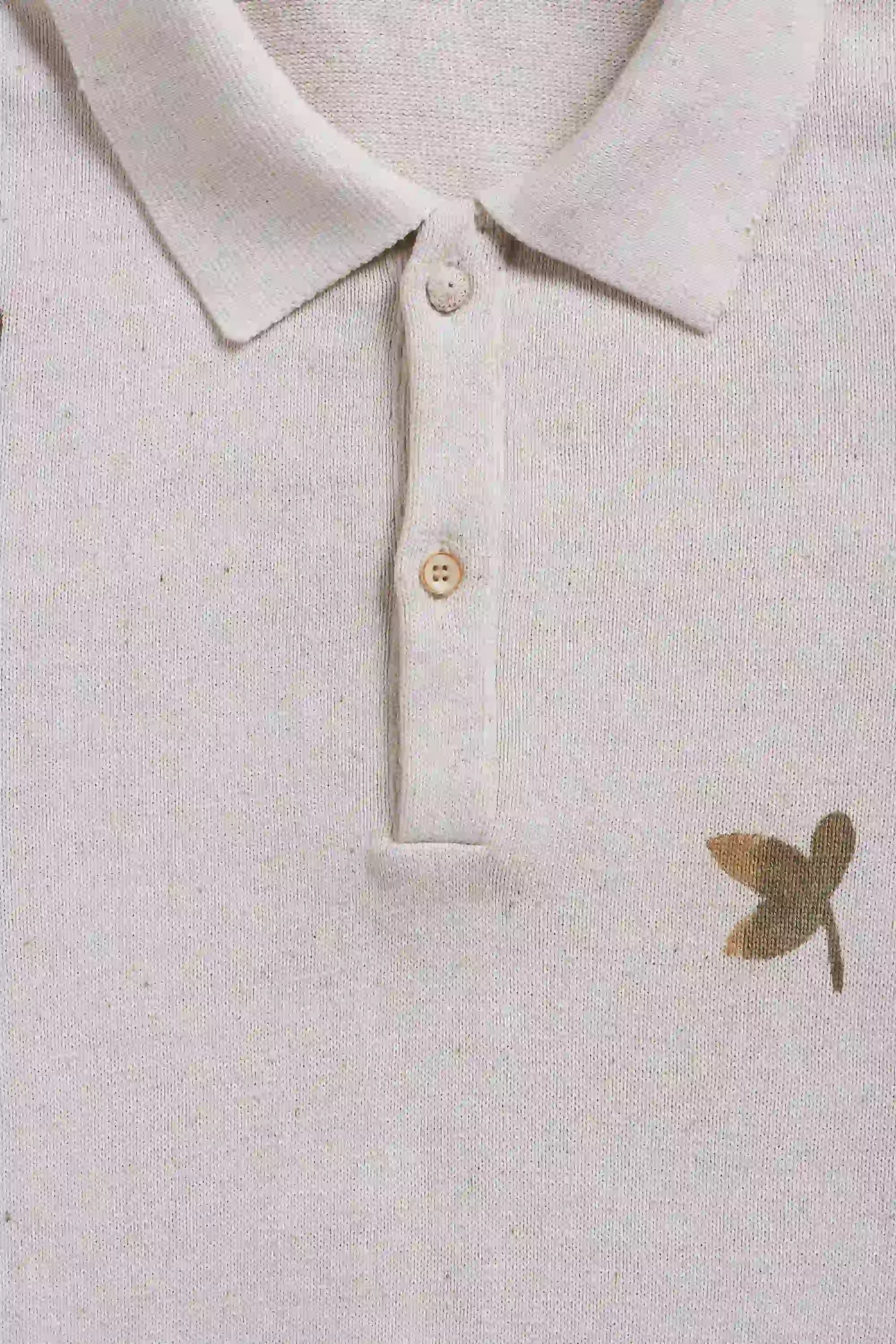 Fabric close-up with button and handpaint