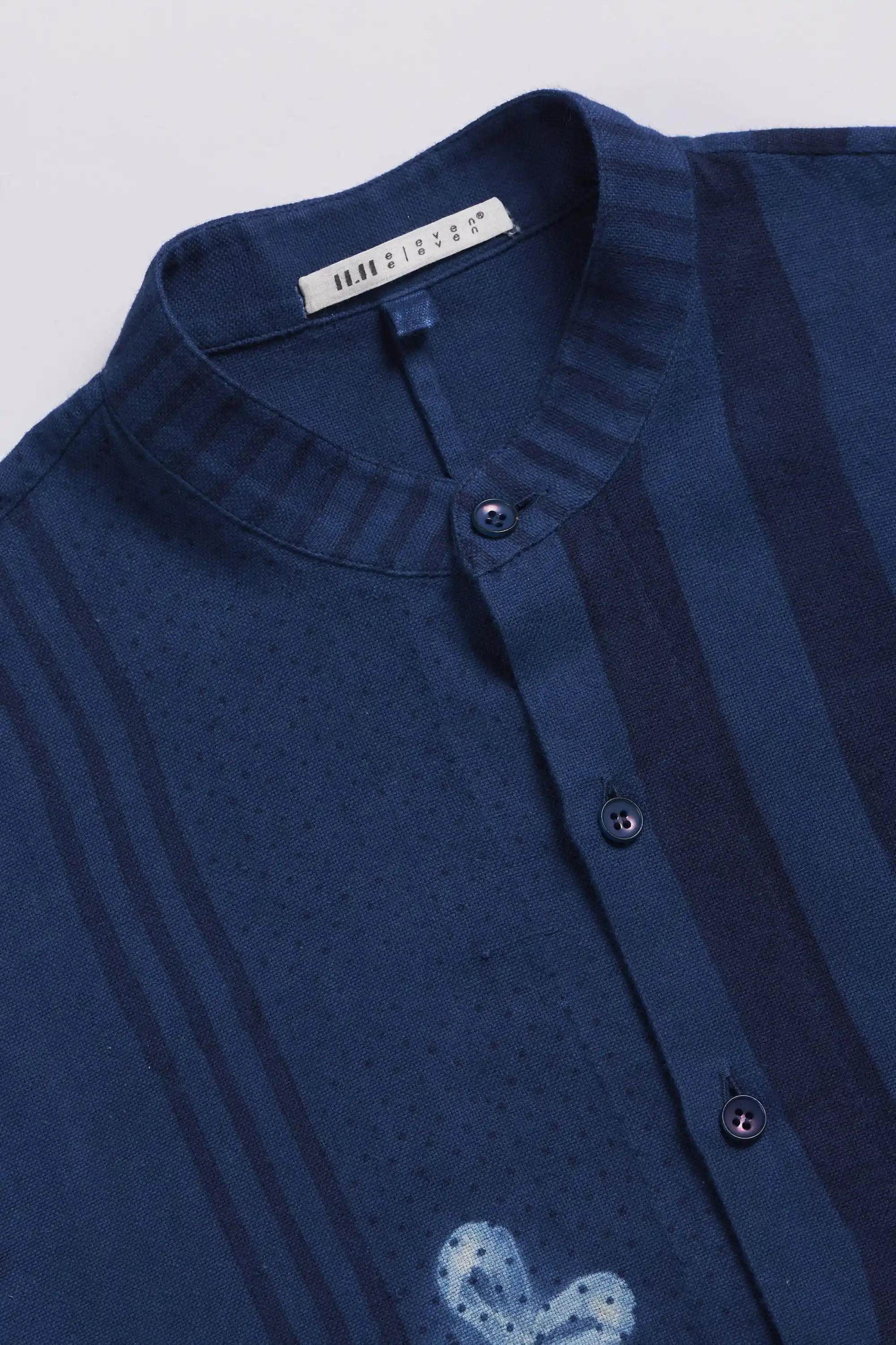 Fabric close-up with band collar and buttons