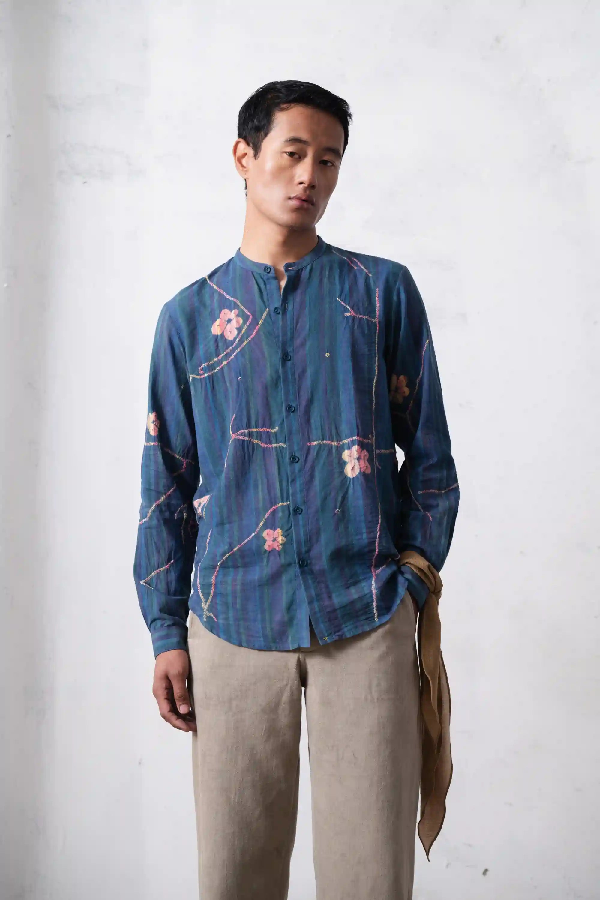 A man wearing sky indigo cotton shirt