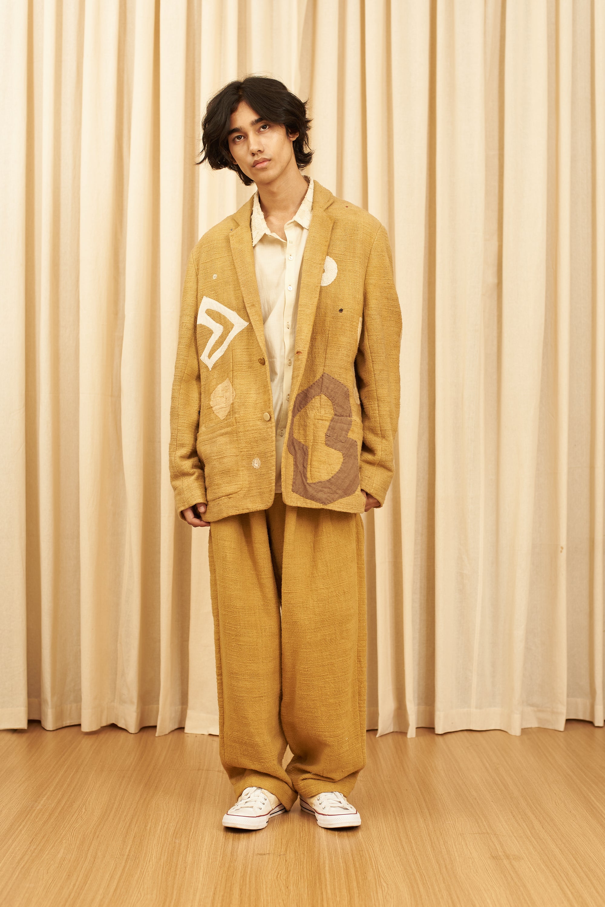 MUSTARD YELLOW TEXTURED PLEATED TROUSERS