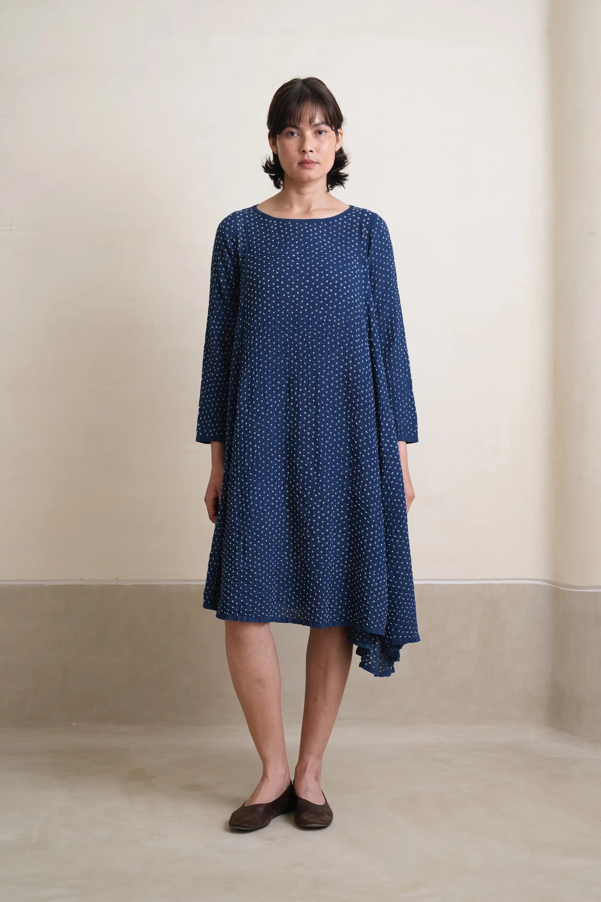 A woman wearing medium indigo dress