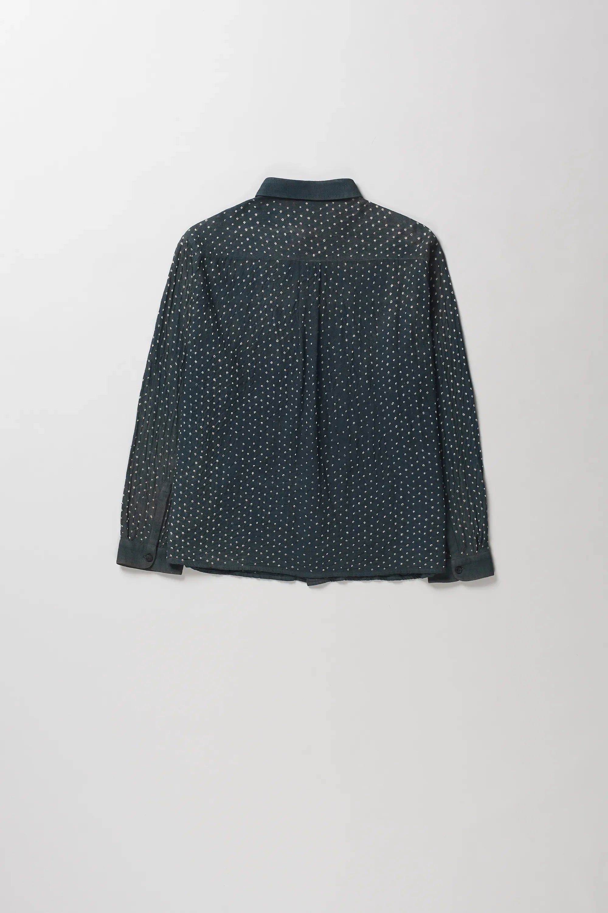 Back shot of shirt with a small white micro-dot bandhani, shown from the back against a light gray background.