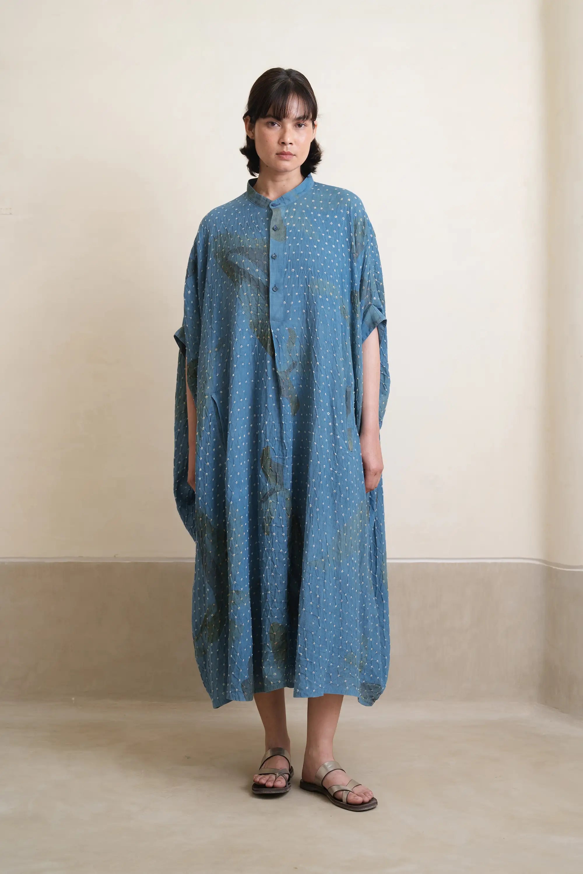 A woman wearing cotton light indigo dress