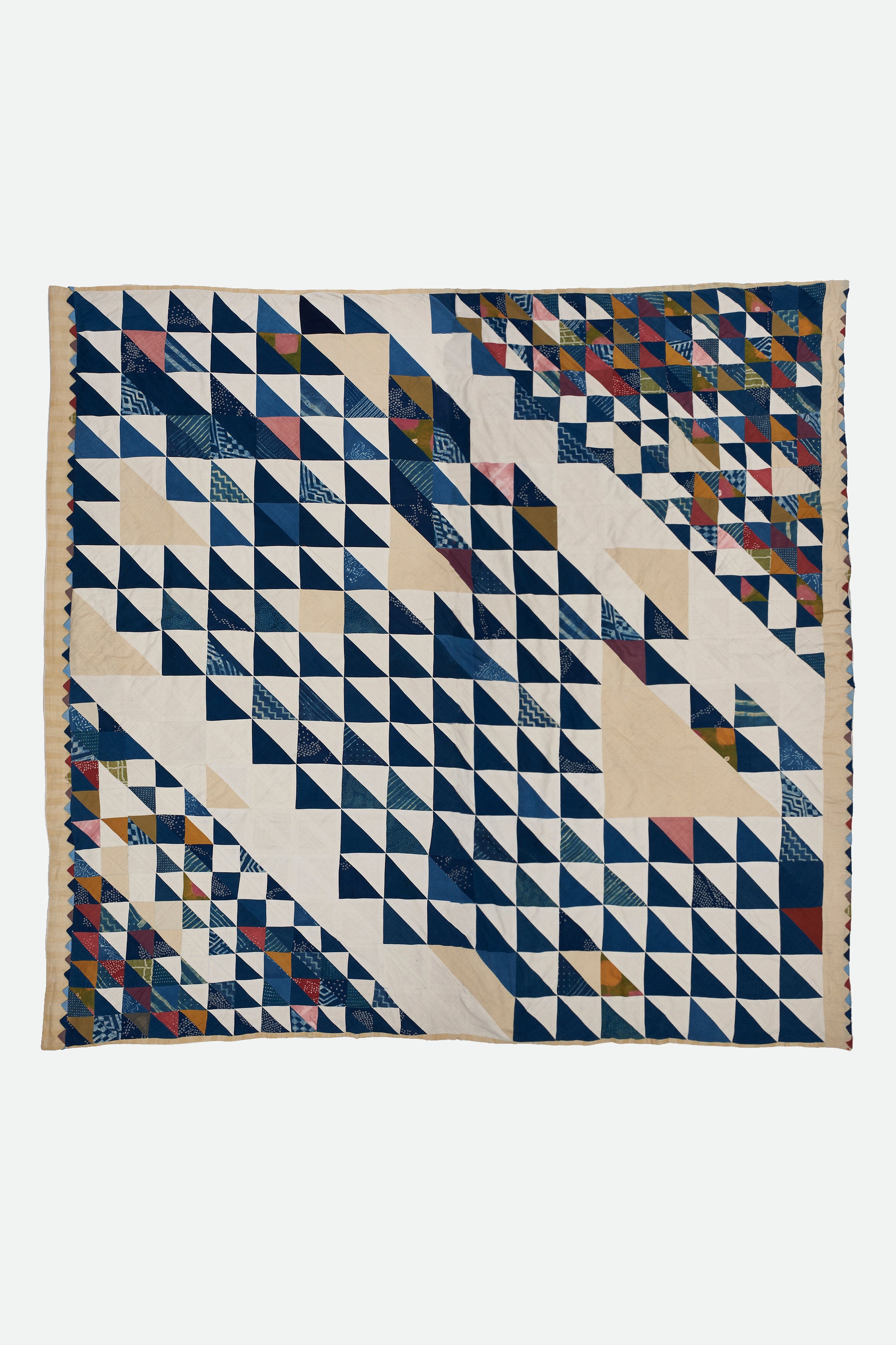 ANGULAR PATCHWORK QUILT IN SHADES OF ECRU AND INDIGO