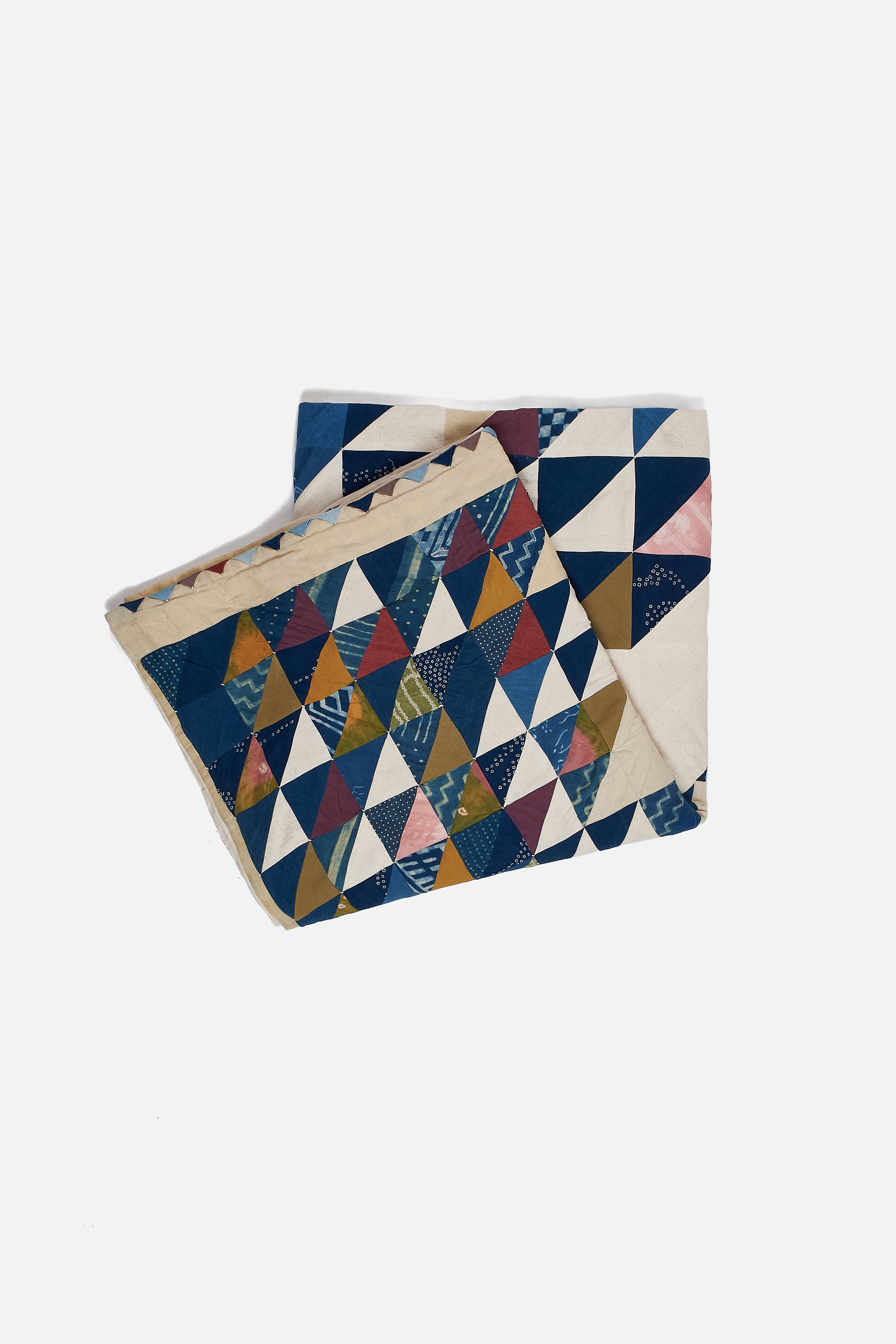 ANGULAR PATCHWORK QUILT IN SHADES OF ECRU AND INDIGO