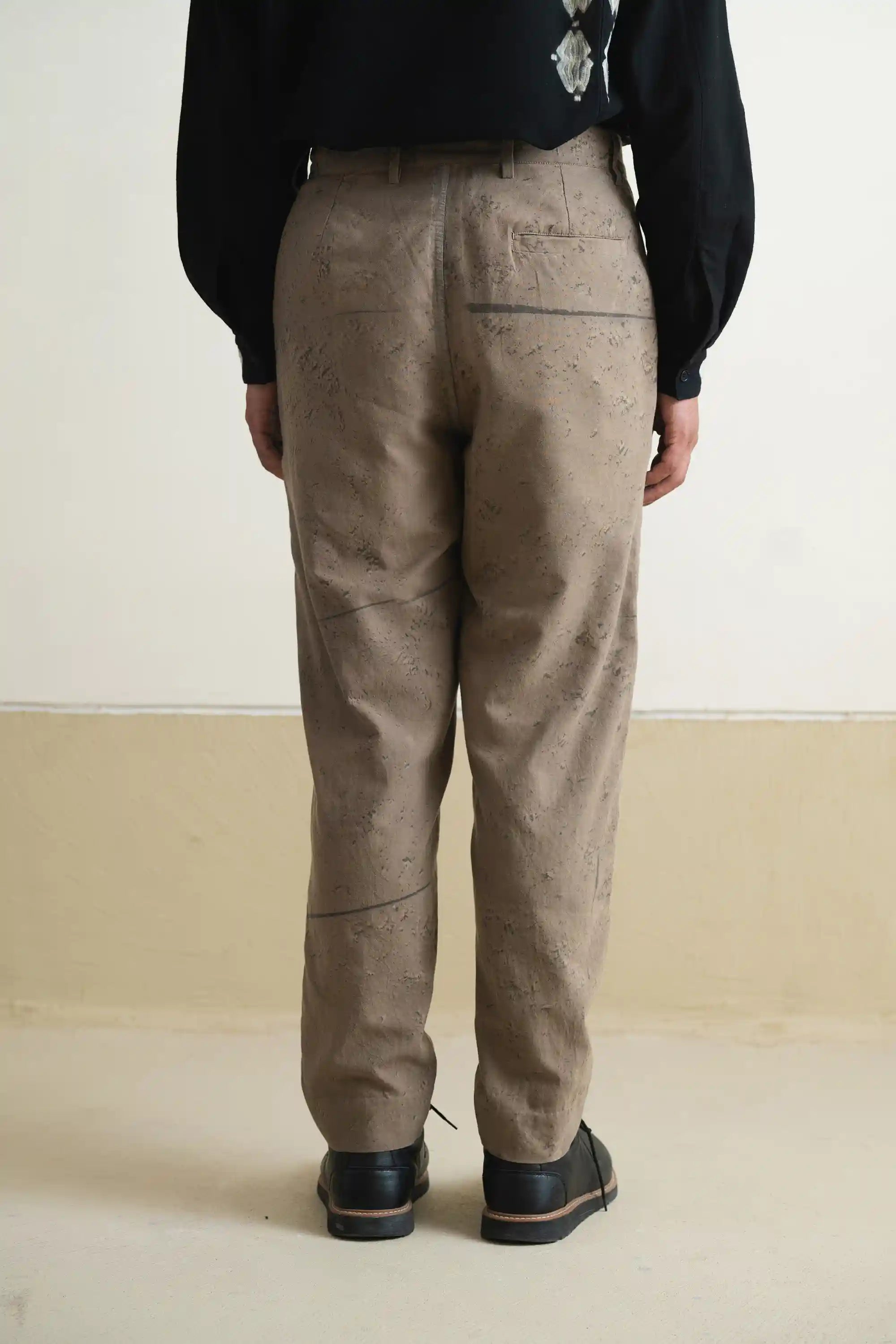 A back shot of a man wearing khaki green cotton pant
