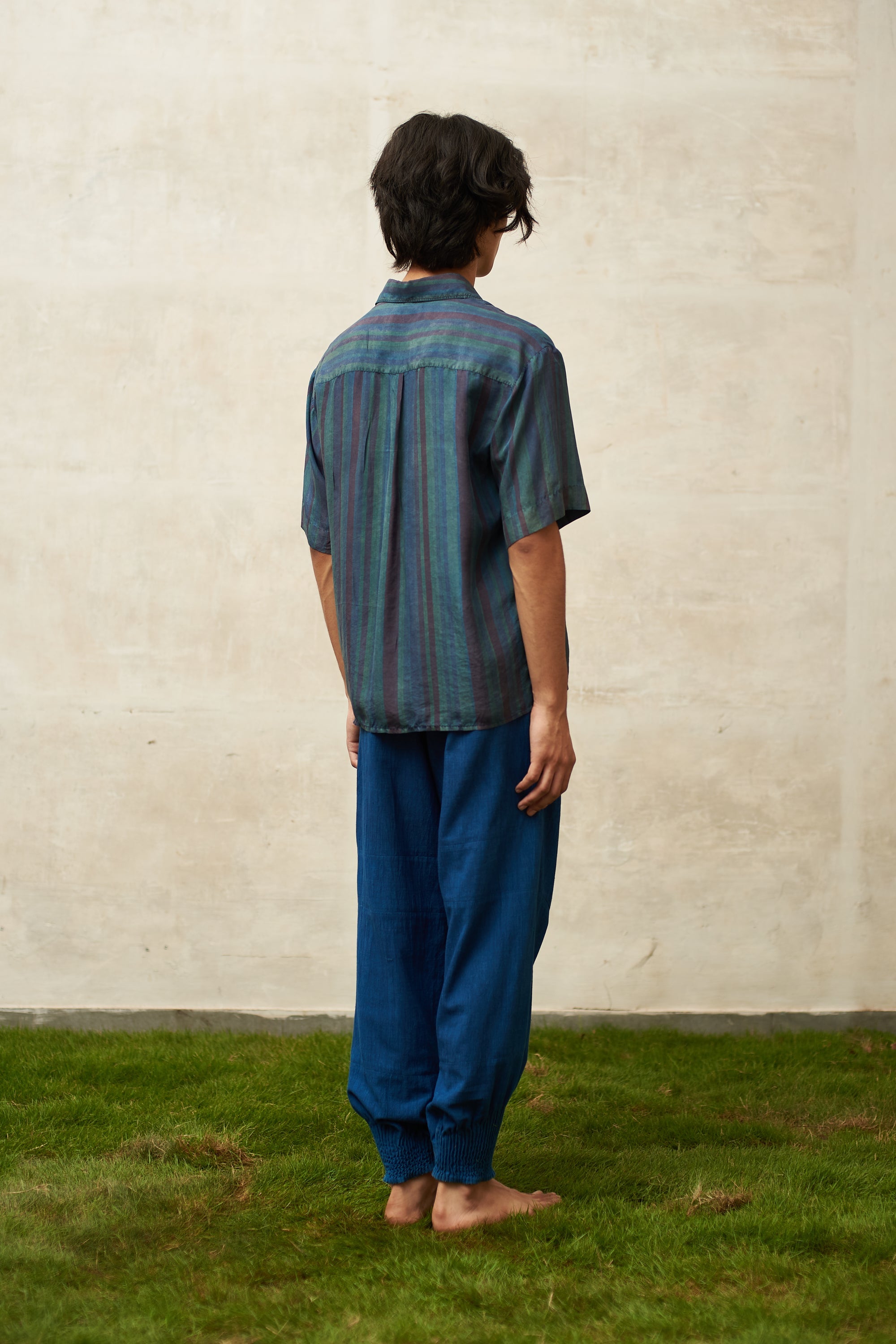 Back image of a medium indigo cotton pant