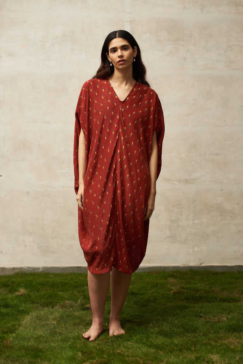 RED BLOCK PRINTED STATEMENT DRAPE DRESS